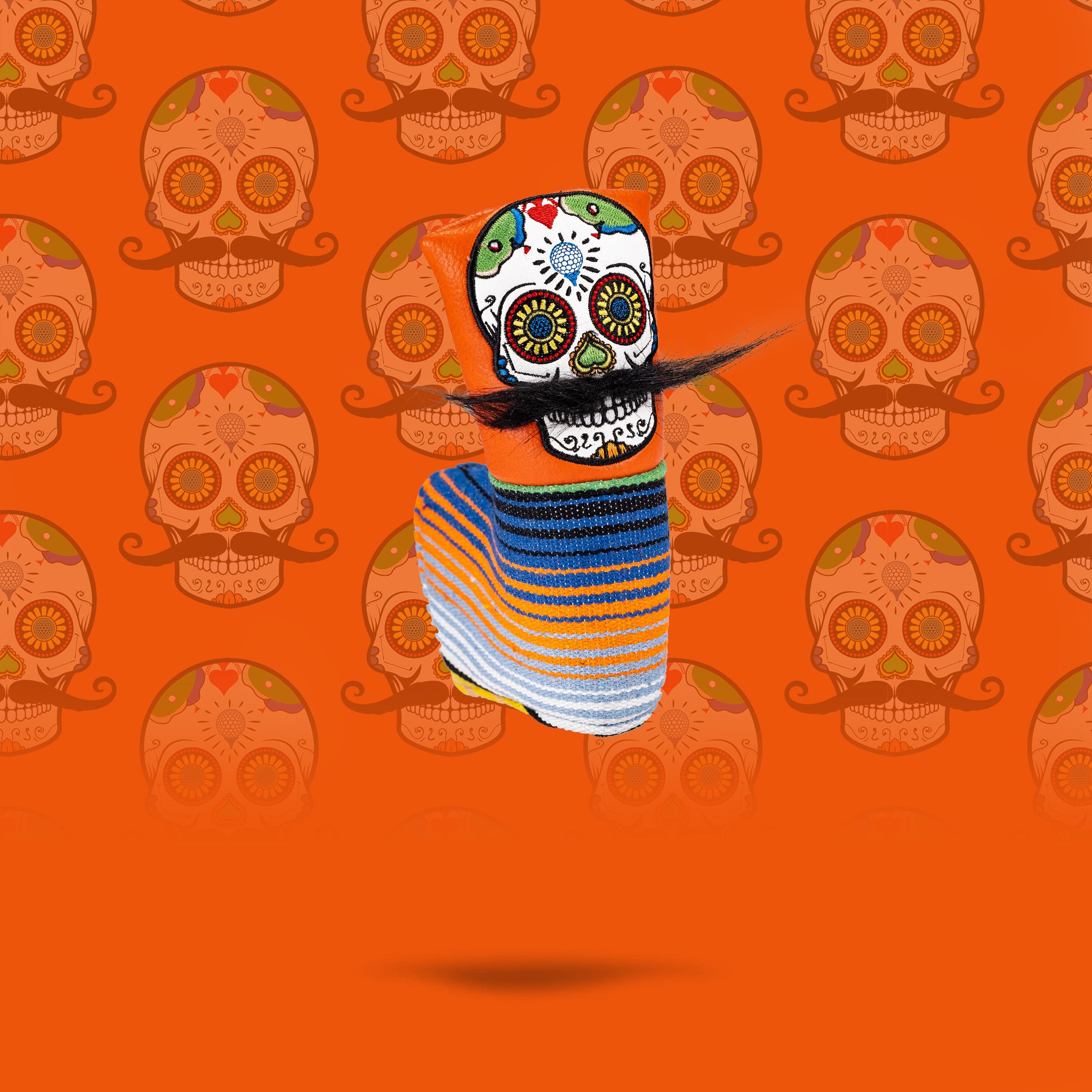 Orange mustache sugar skull blade putter cover with intricate designs.