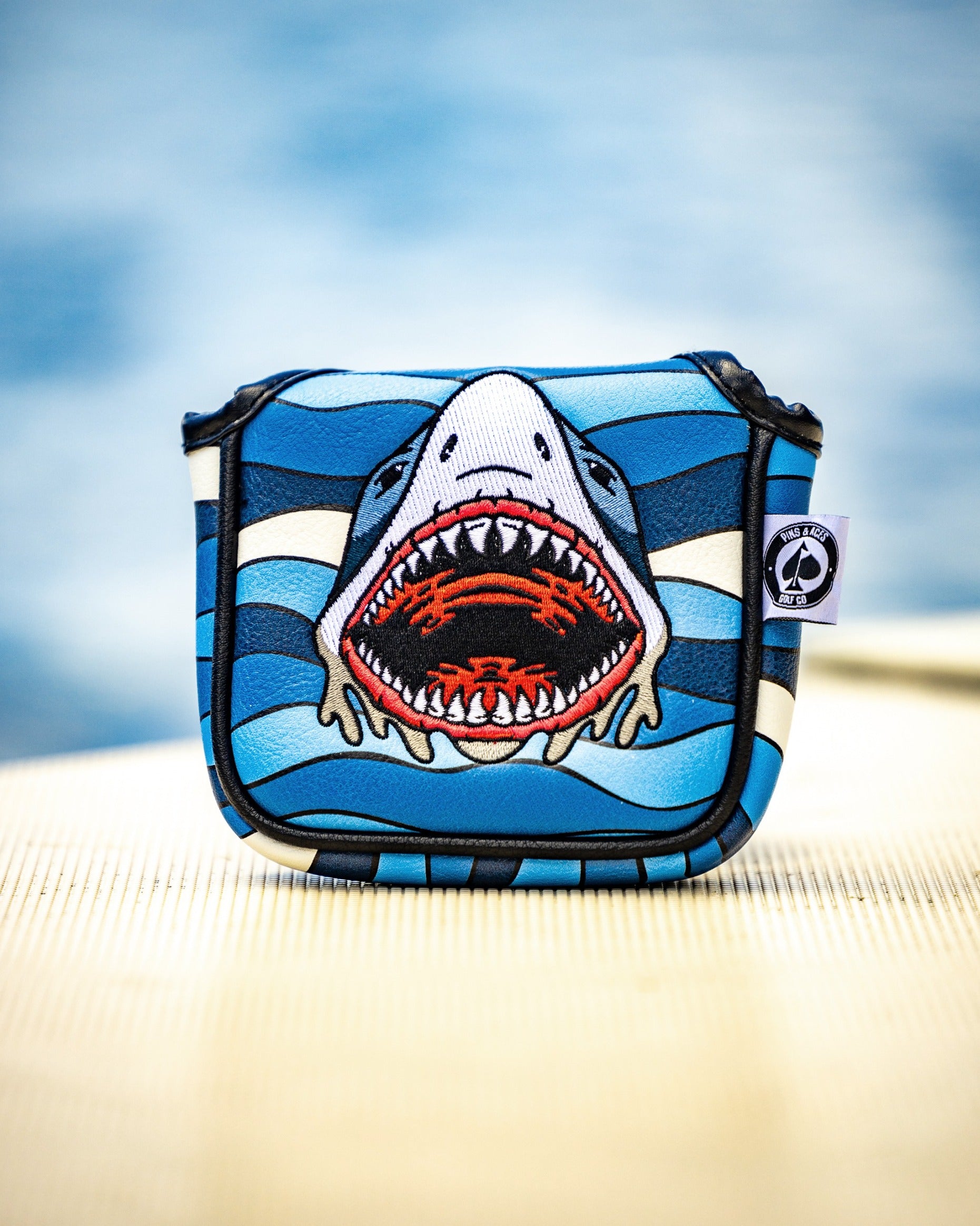 Bold shark-themed mallet cover featuring vibrant colors and a fierce design, perfect for golfers wanting to stand out.