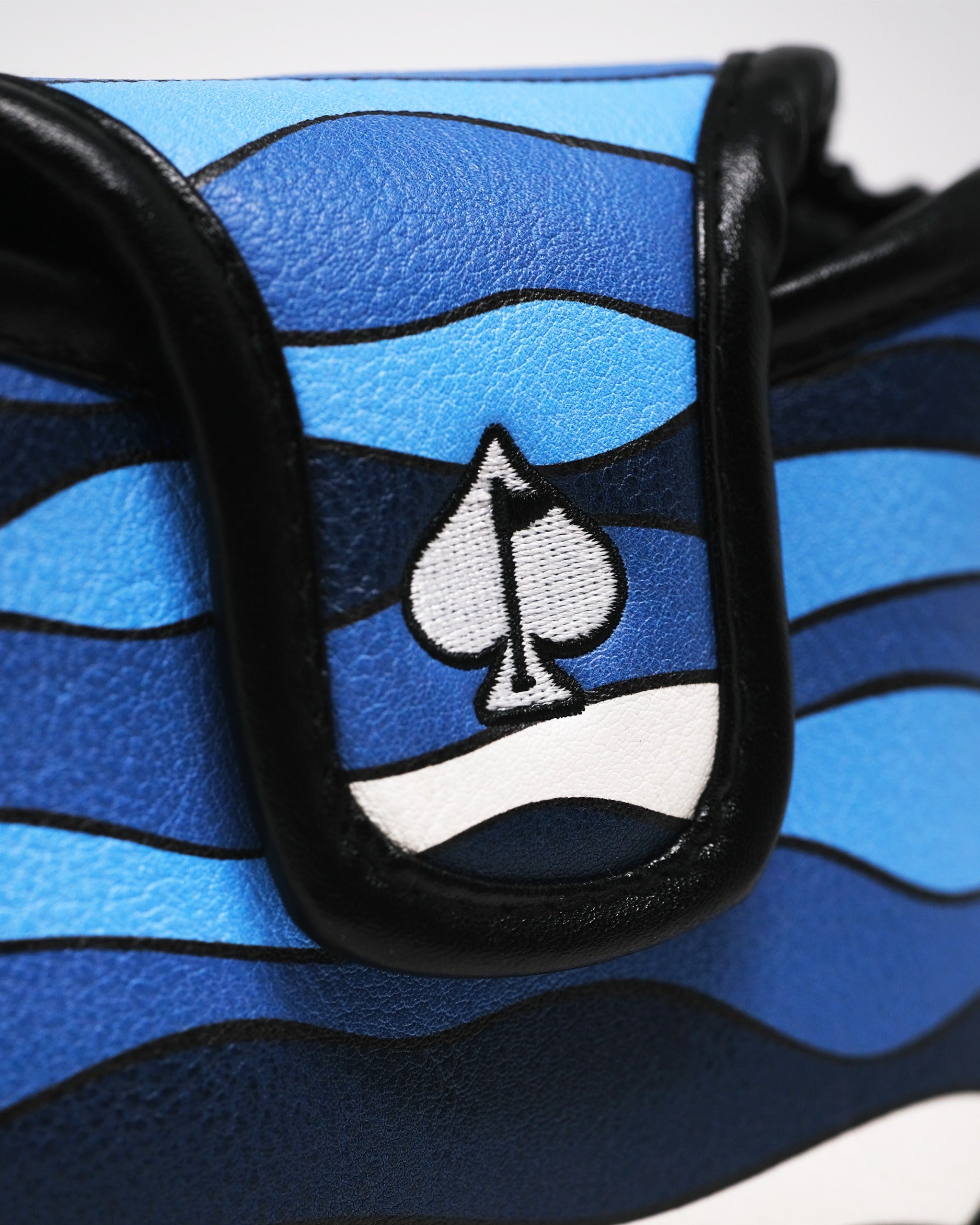 Bold Shark Attack mallet cover featuring vibrant blue waves and a spade logo, designed for standout golf style.