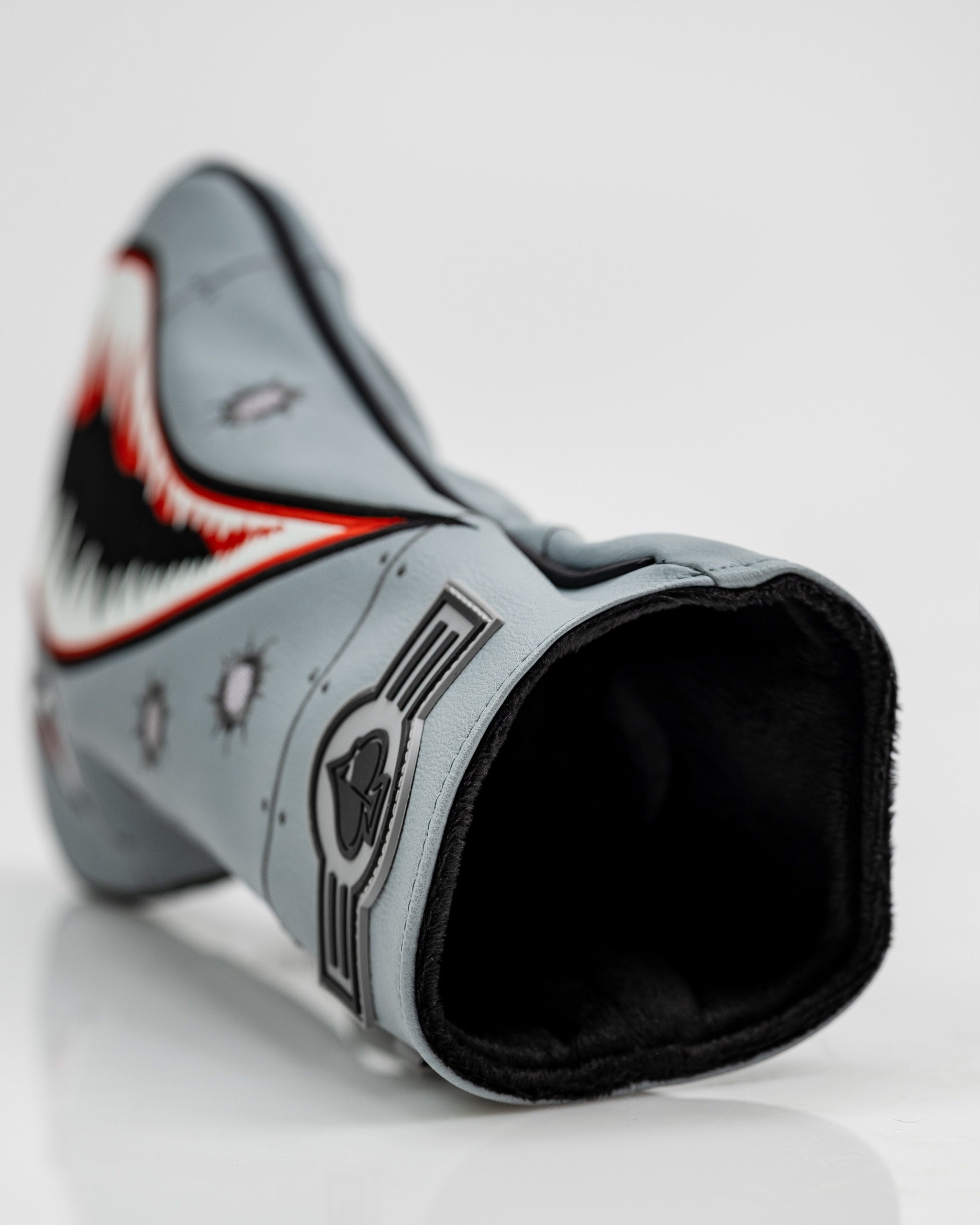 Bold bomber driver cover featuring a shark design with striking colors, perfect for golfers looking to stand out on the course.