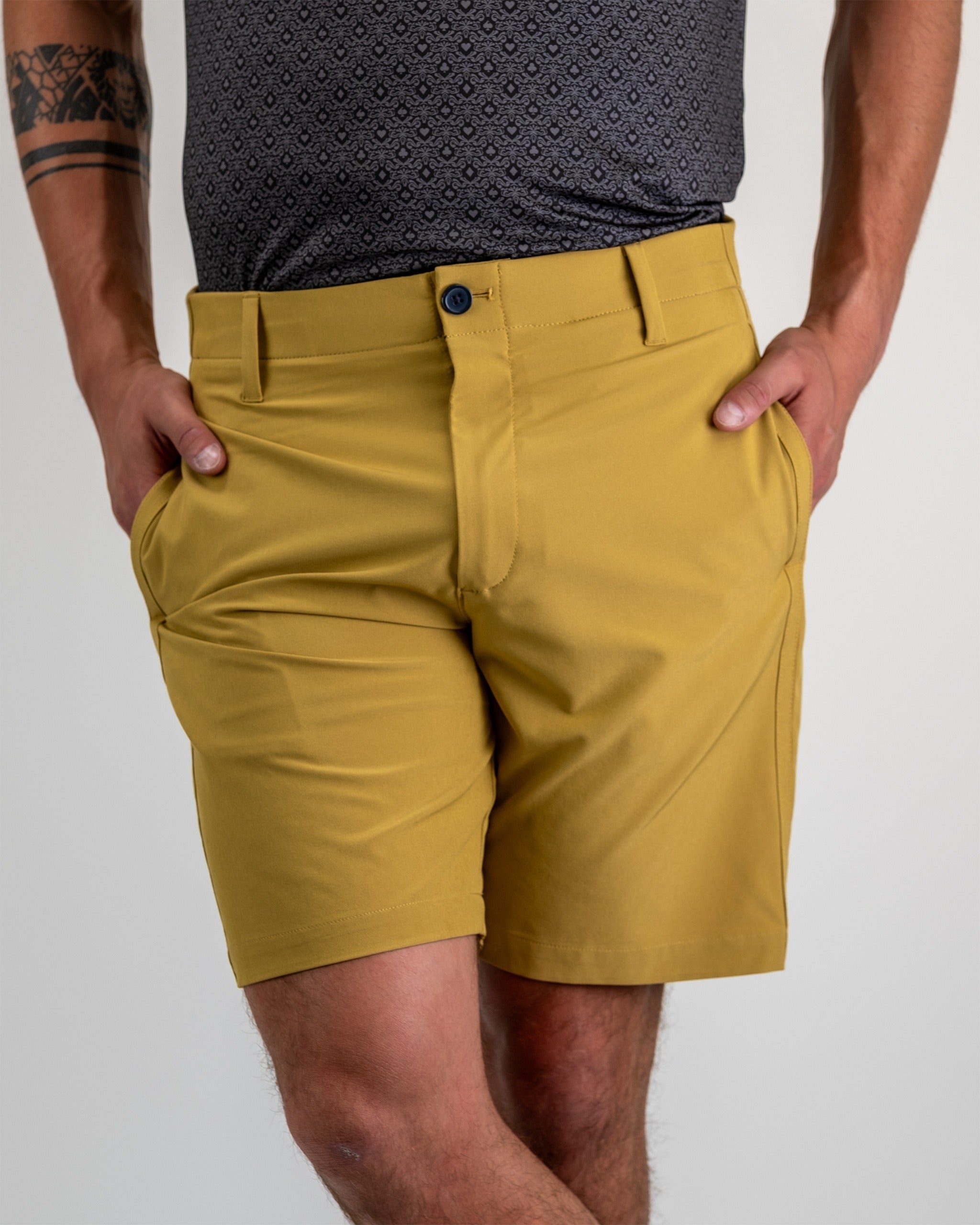 Beige performance shorts featuring a lightweight, breathable fabric, ideal for active wear.