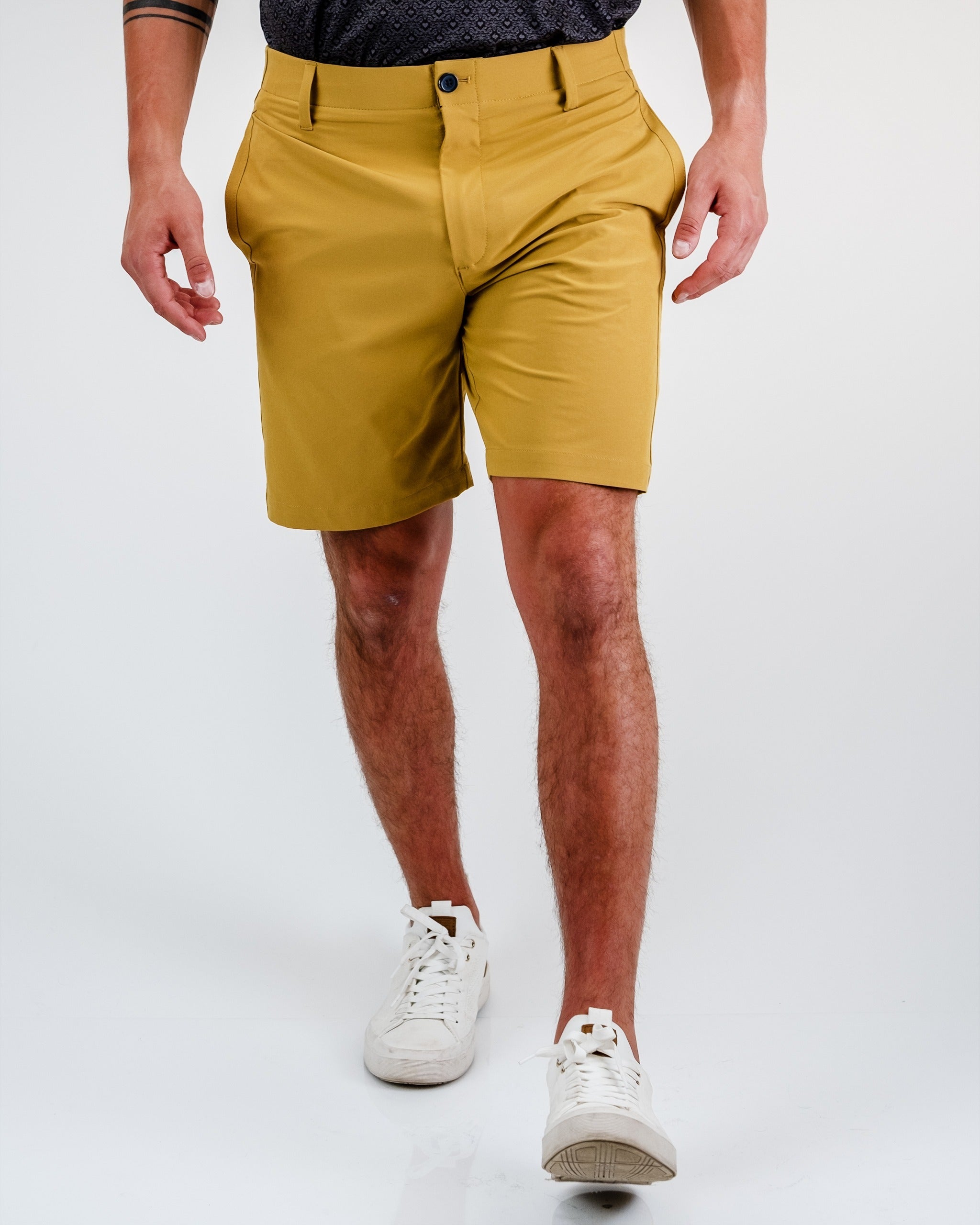 Performance shorts in Dune color, showcasing a lightweight fabric and dynamic fit.