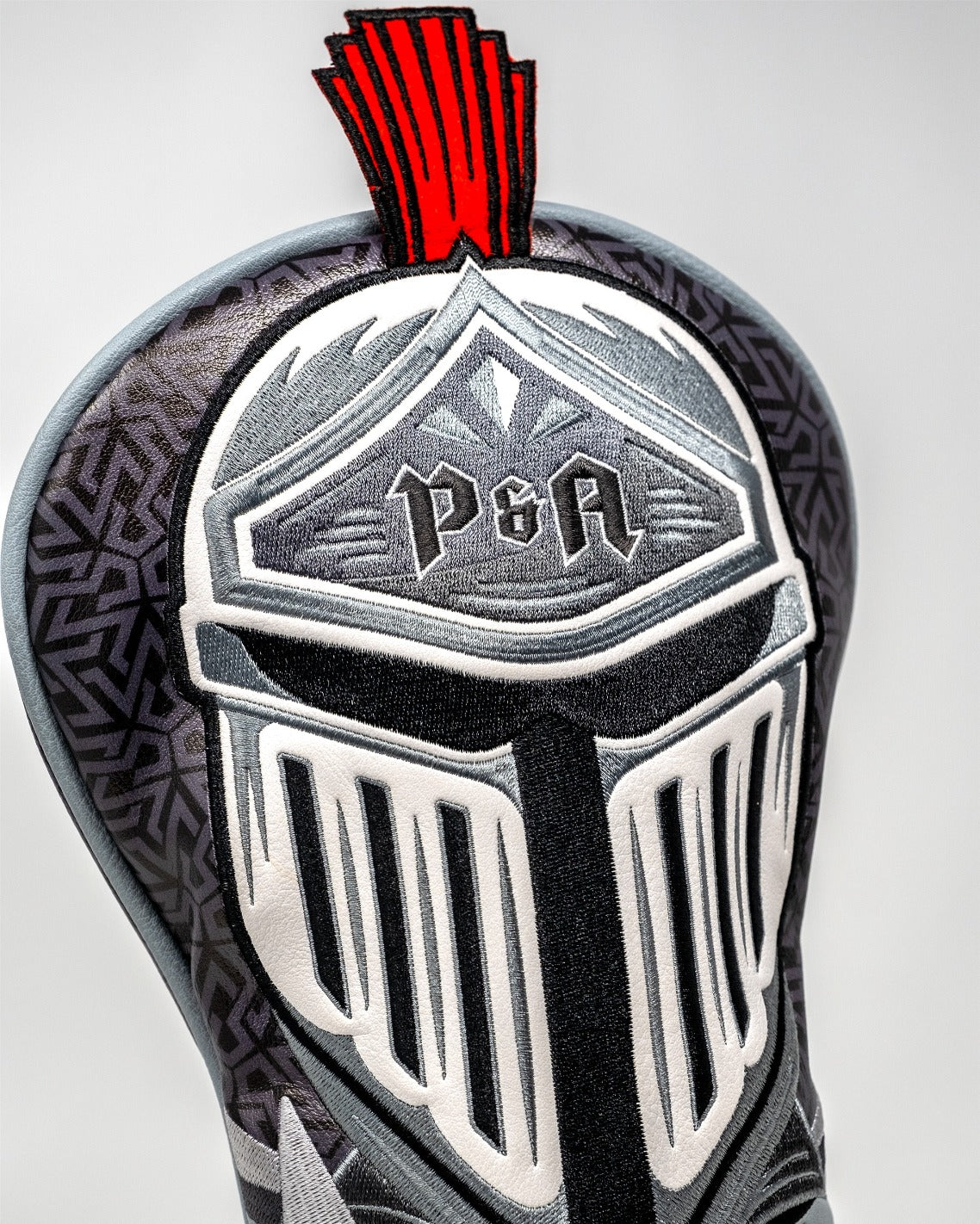 Knight's Valor driver cover featuring a detailed knight design with a striking red plume, perfect for bold golfers.