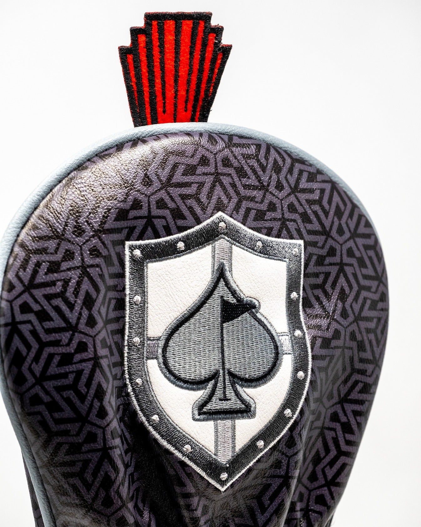 Bold driver cover featuring a shield design with an ace of spades emblem and striking red accents, perfect for standout golfers.