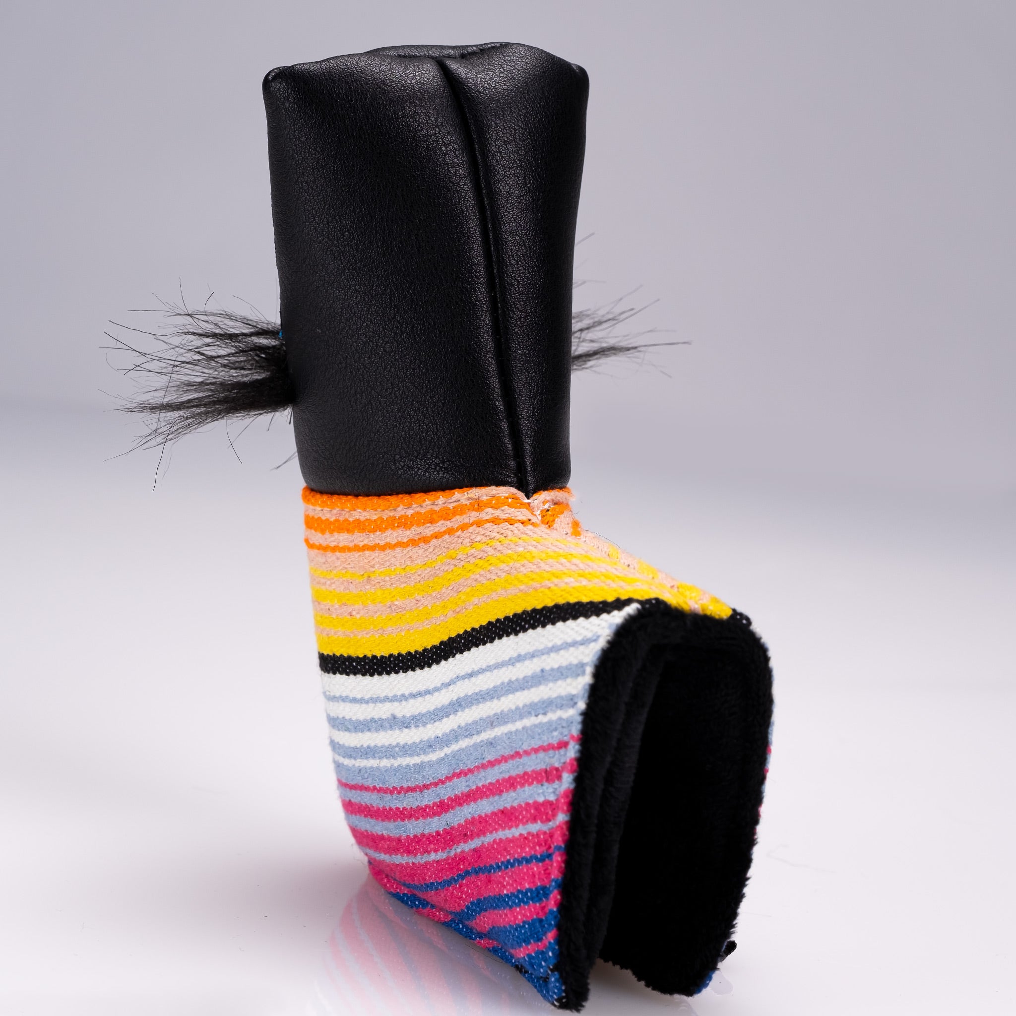 Bold black blade putter cover featuring a colorful mustache sugar skull design and playful hair accents. Perfect for unique golf style.