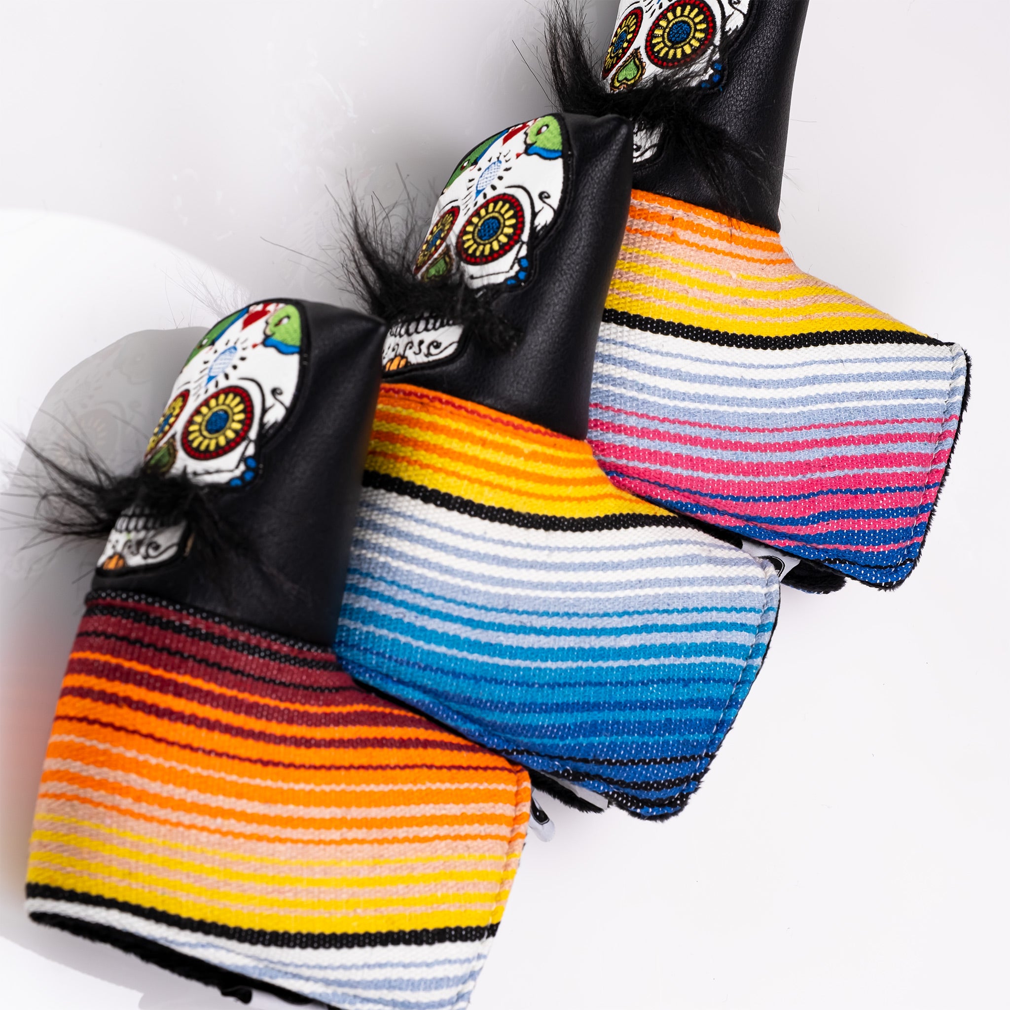 Bold black putter cover featuring a colorful mustache sugar skull design and vibrant striped patterns for standout style.
