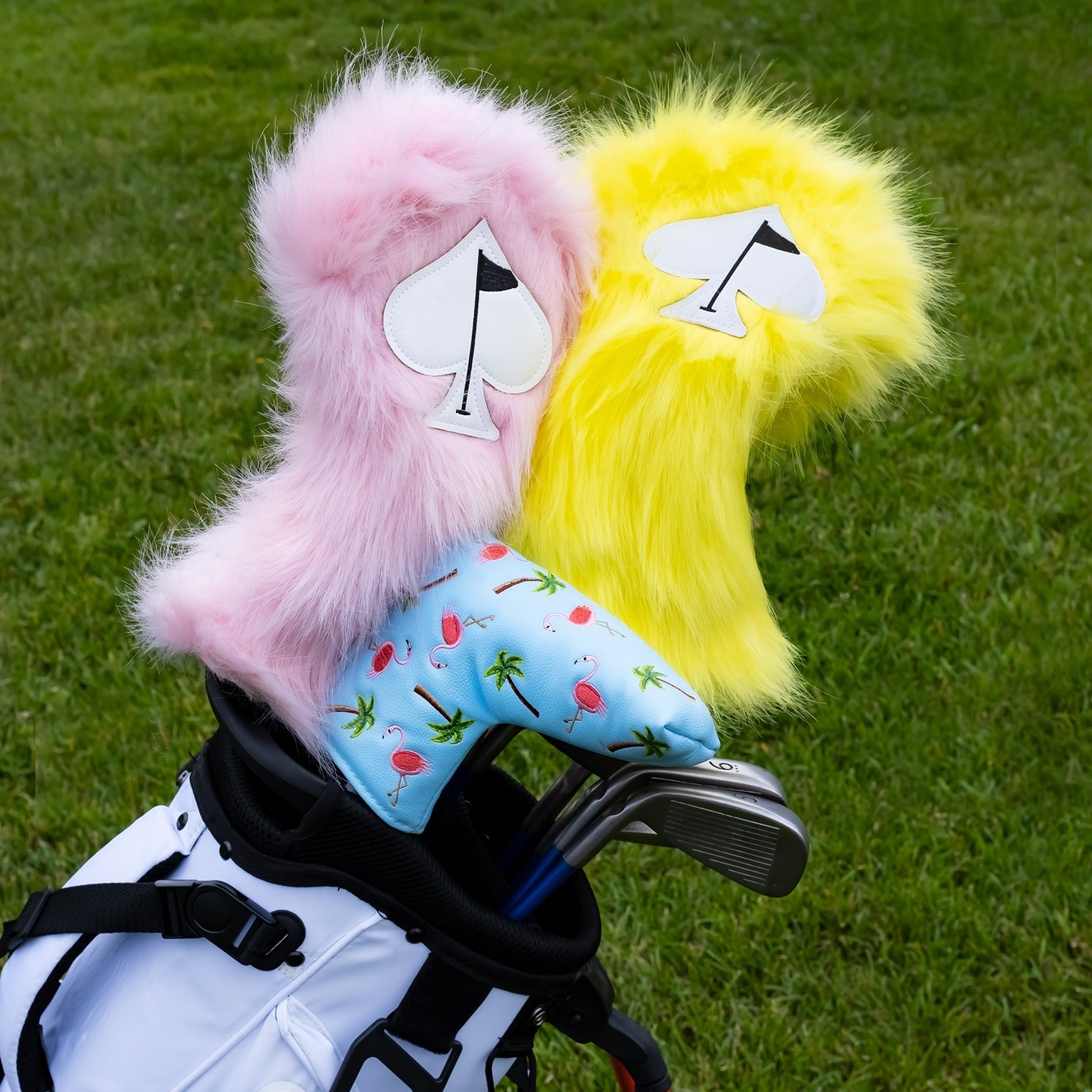 Bright yellow fuzzy fairway cover featuring a playful ace of spades design, perfect for adding flair to your golf bag.
