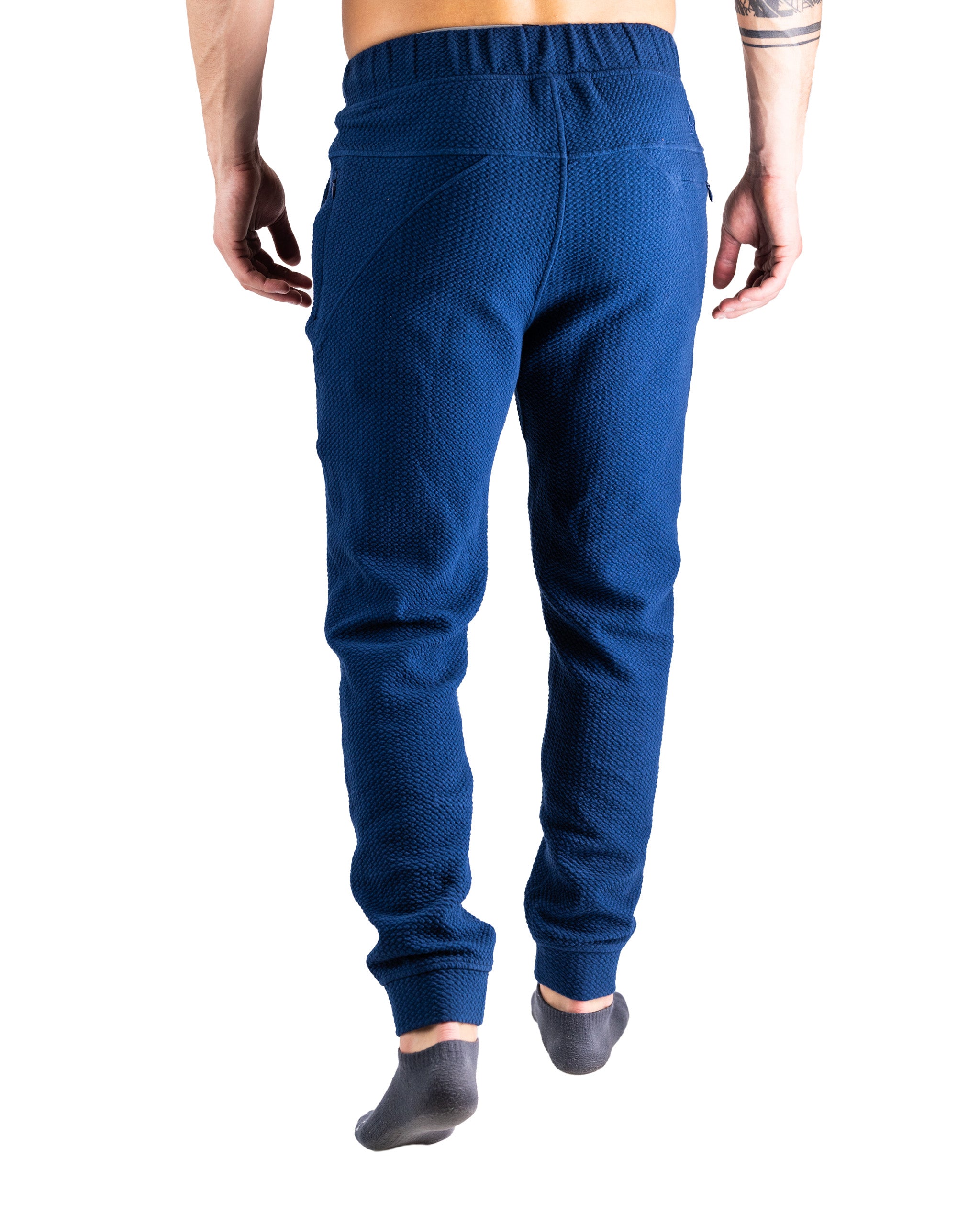 Men's navy waffle-knit jogger pants with a relaxed fit and elastic waistband, designed for comfort and style.