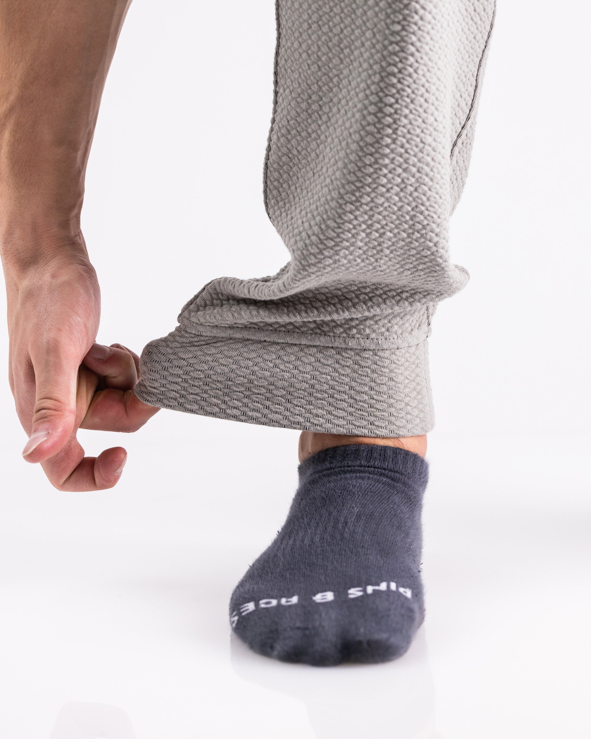 Slate Player Preferred Waffleknit Jogger showcasing a close-up of the cuff being adjusted over a dark sock.