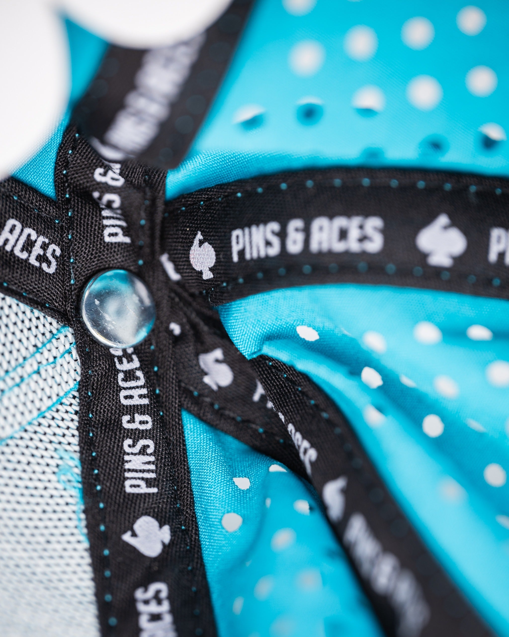 Perforated baby blue rope hat featuring a stylish design and breathable material for comfort on the golf course.