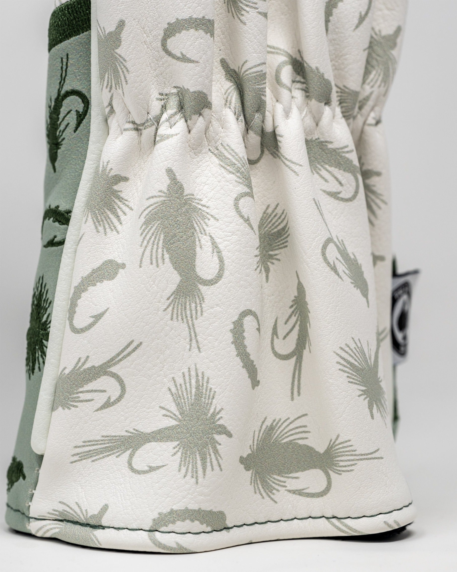 Trout driver cover featuring a stylish design with fish patterns in muted green and white, perfect for golf enthusiasts.