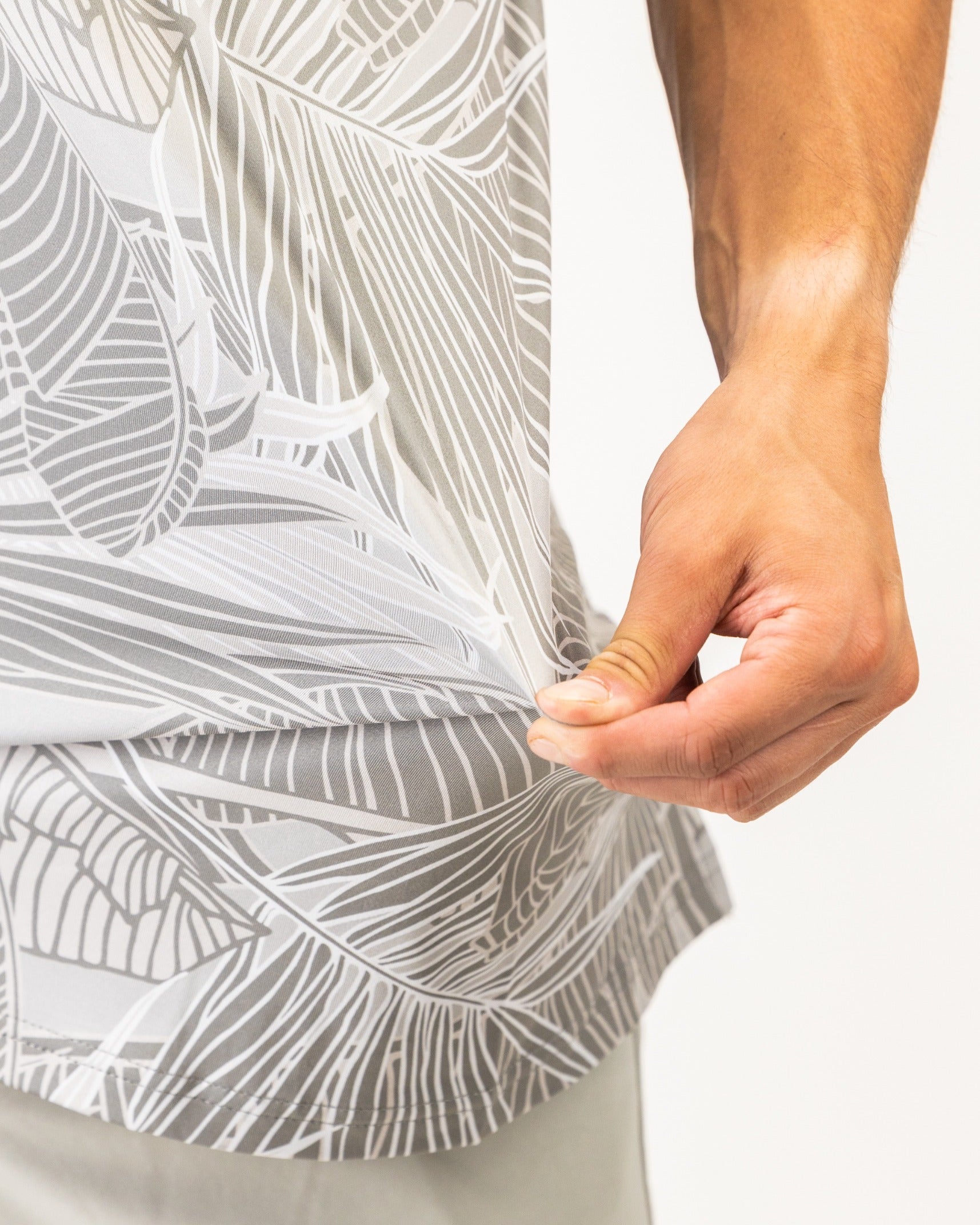 Men's golf shirt featuring a stylish palm leaf design, highlighting a comfortable fit and breathable fabric.