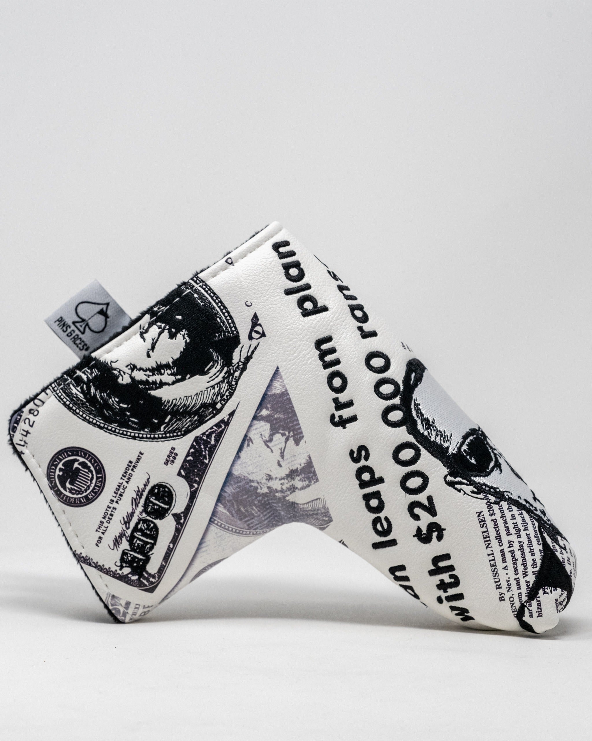 D.B. Cooper Blade Putter Cover featuring a design inspired by dollar bills and the infamous hijacker's story.