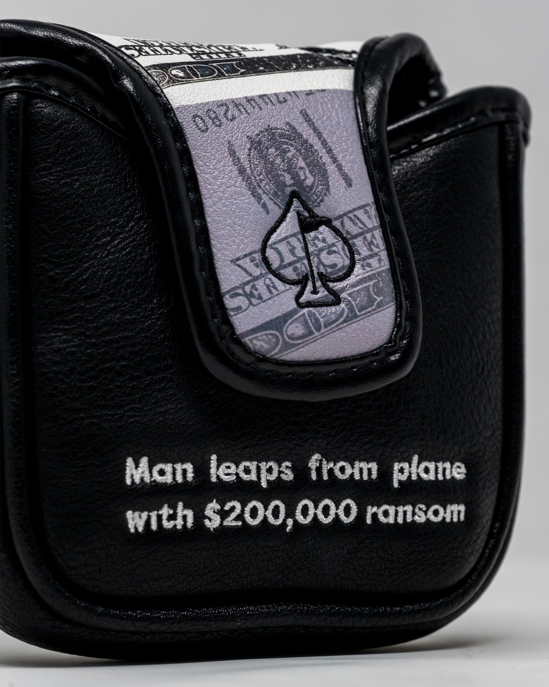 D.B. Cooper mallet putter cover featuring a design inspired by the infamous hijacker and a $200,000 ransom note.