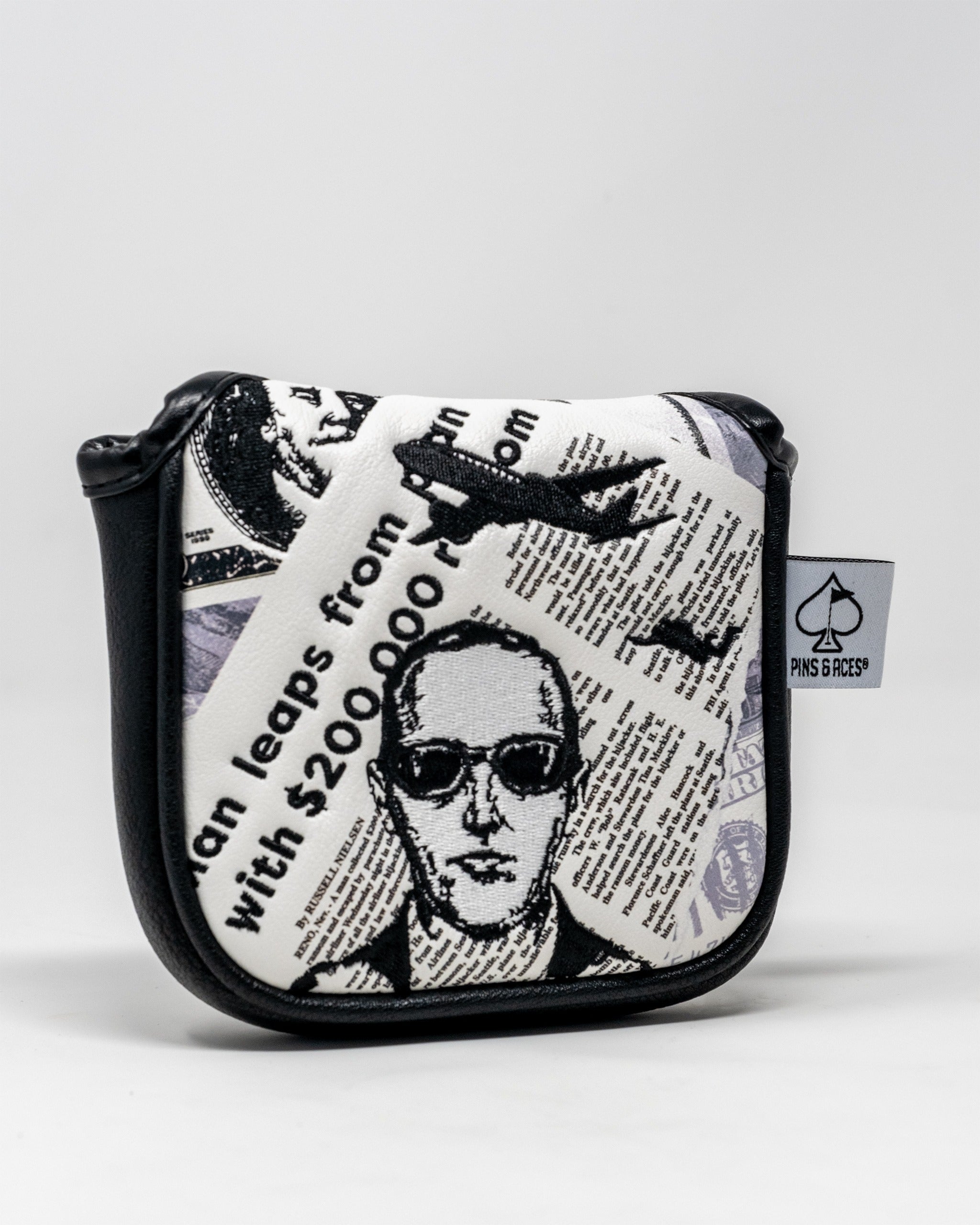 D.B. Cooper mallet putter cover featuring a bold design with newspaper clippings and a graphic of the infamous figure.