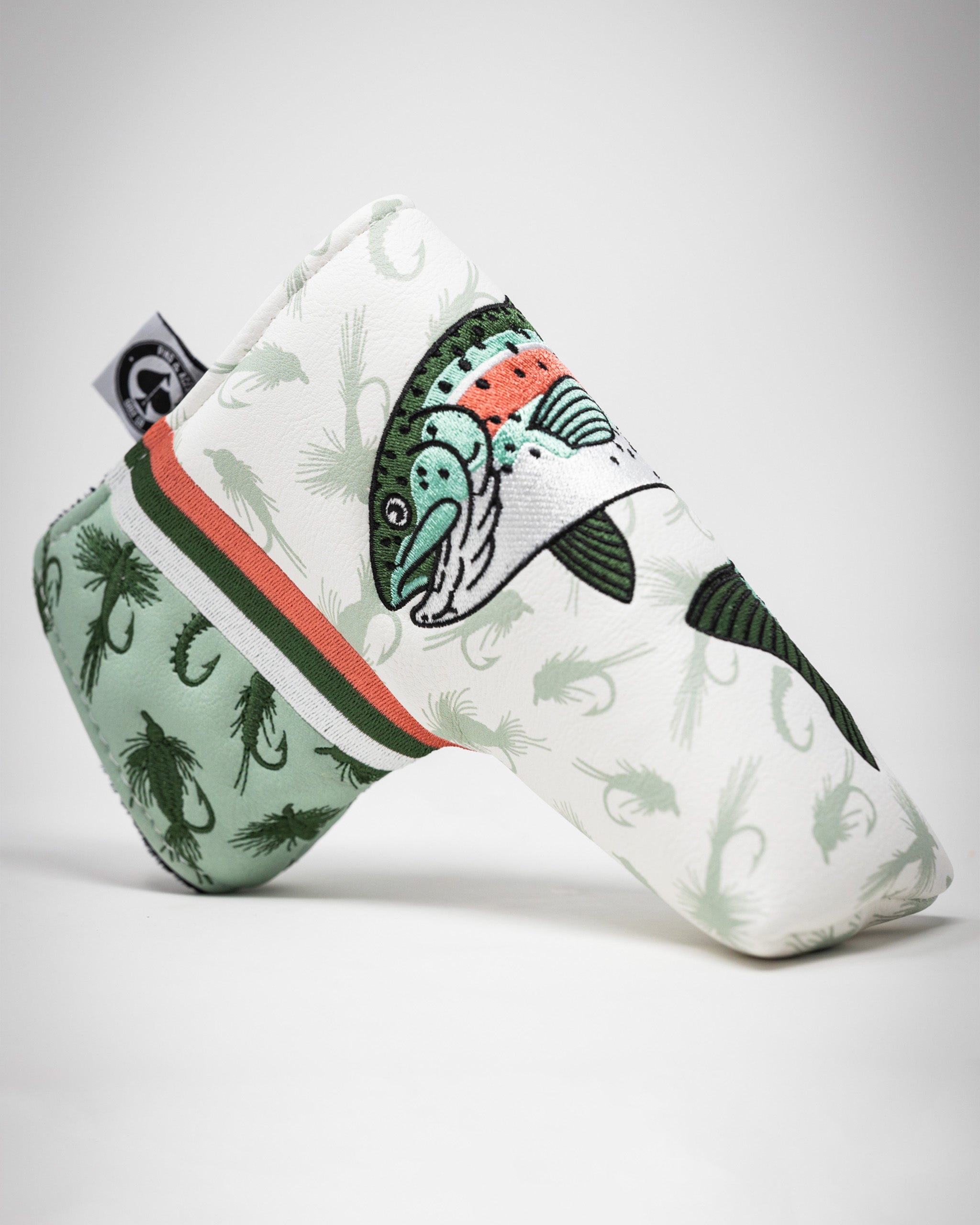 Trout Blade Putter Cover featuring a vibrant fish design and a stylish green and white pattern for golfers.