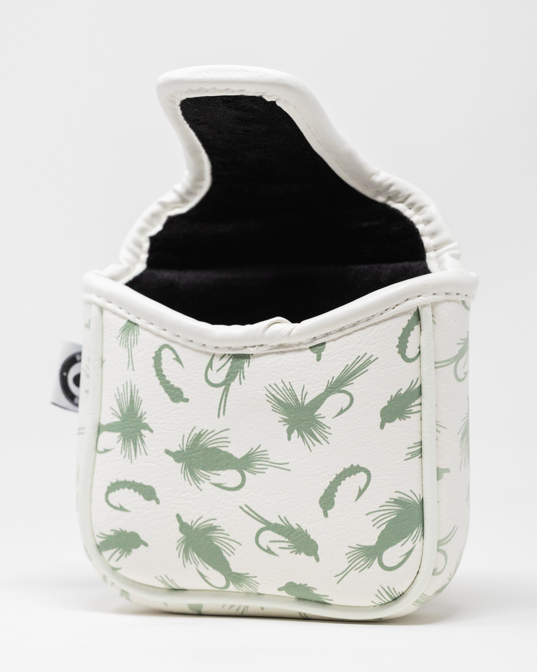 Trout mallet putter cover featuring a white exterior with green fish and lure patterns, designed for stylish golf protection.