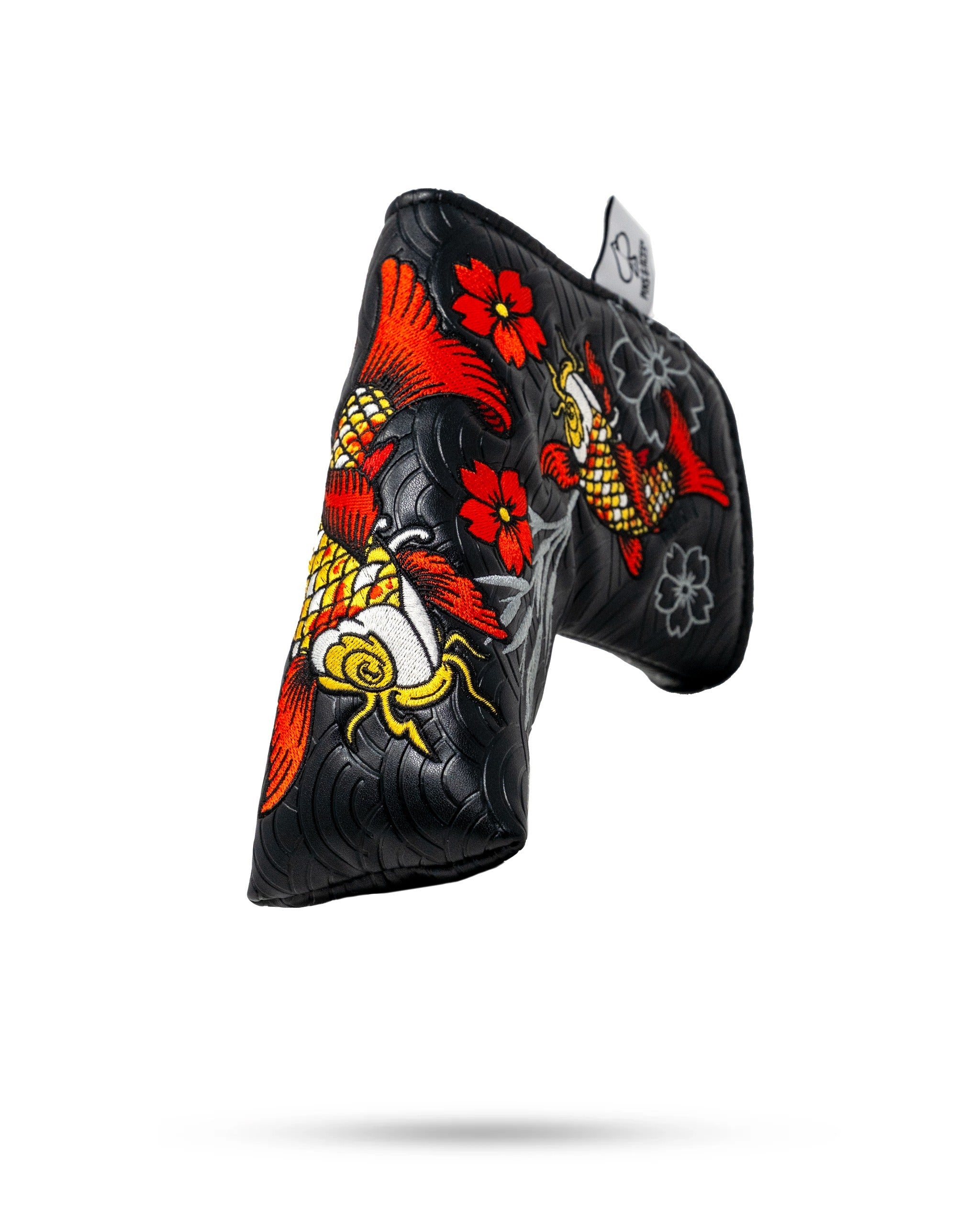 Koi Flow blade putter cover featuring vibrant koi fish and floral designs on a black background for stylish golf protection.