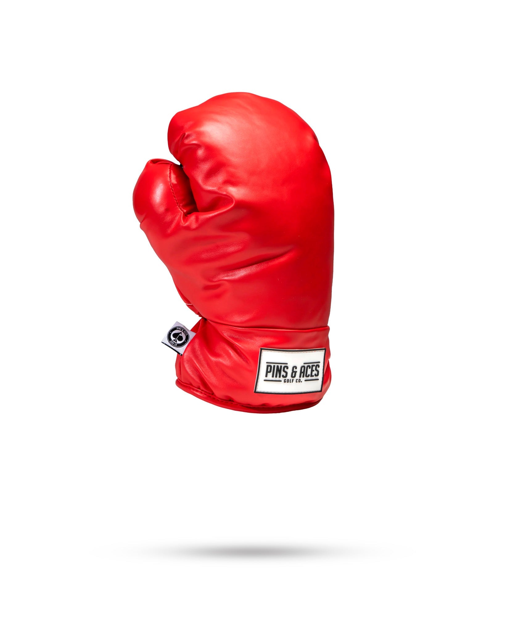 Red boxing glove-shaped fairway cover designed for golfers seeking a bold and unique accessory on the course.
