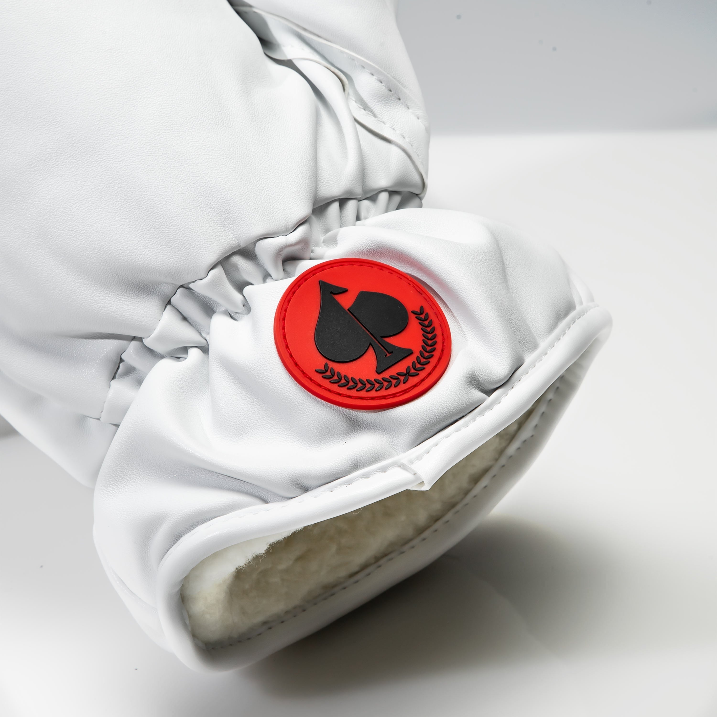 White boxing glove fairway cover featuring a bold red and black logo, designed for stylish golf protection.