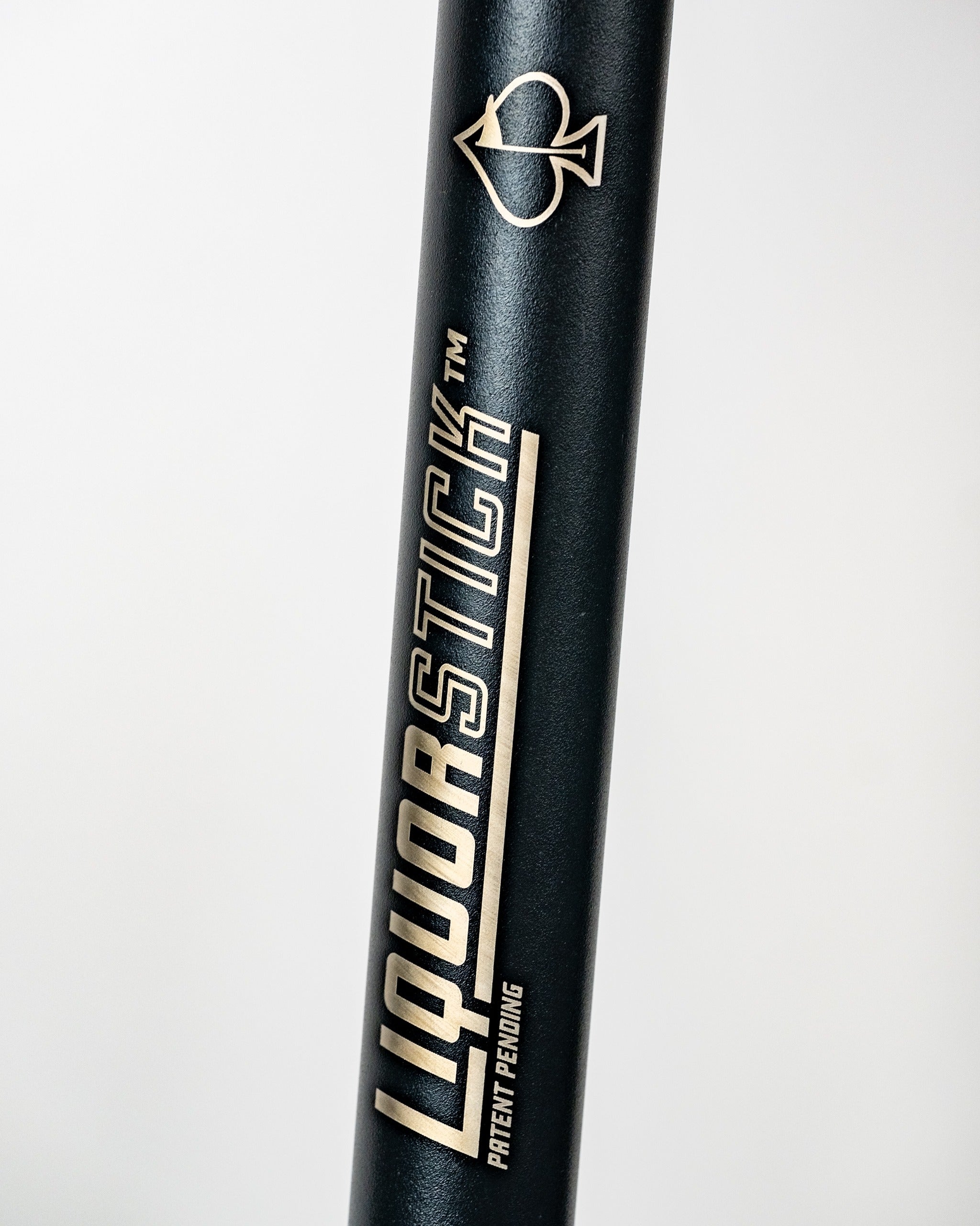 Black LiquorStick® 3.0 featuring a sleek design with gold lettering and a spade logo, ideal for stylish golf outings.