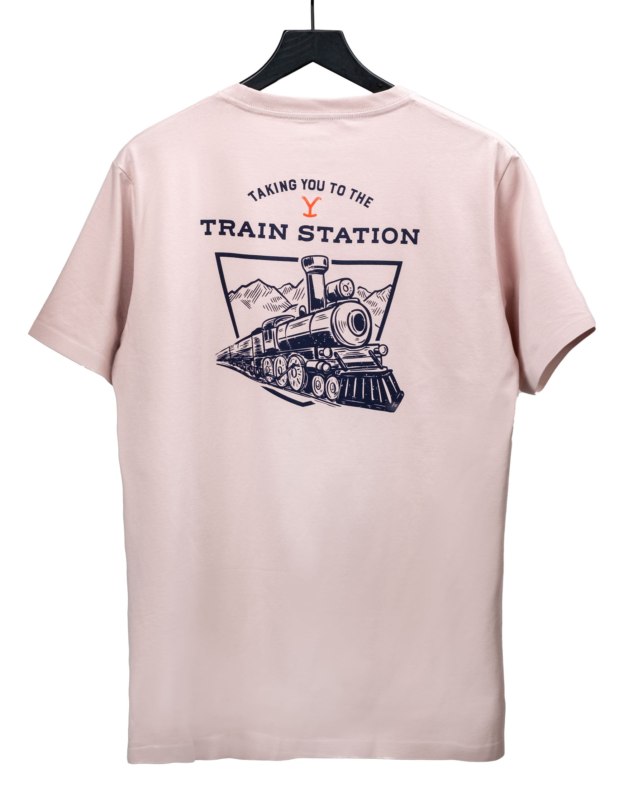 Light pink t-shirt featuring a vintage train graphic and "Taking You to the Train Station" text on the back.