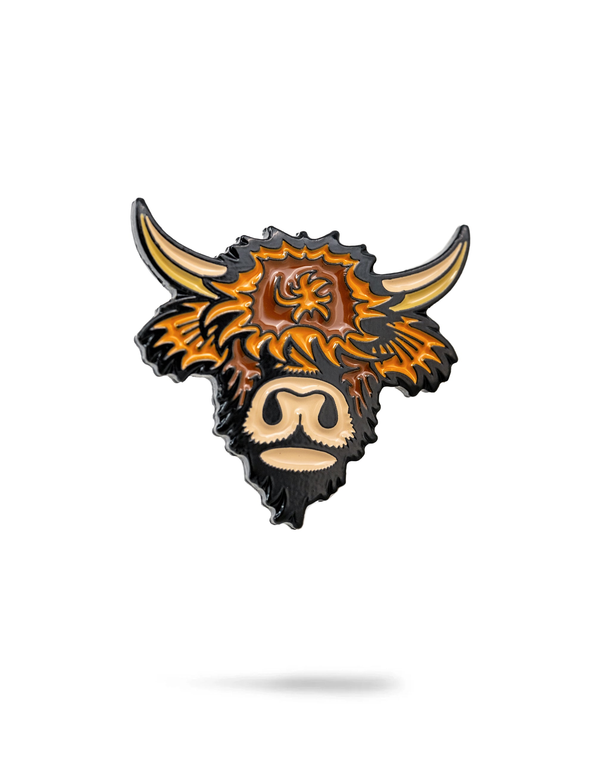 Highland cow ball marker featuring a detailed design with vibrant colors and a glossy finish, perfect for golfers.
