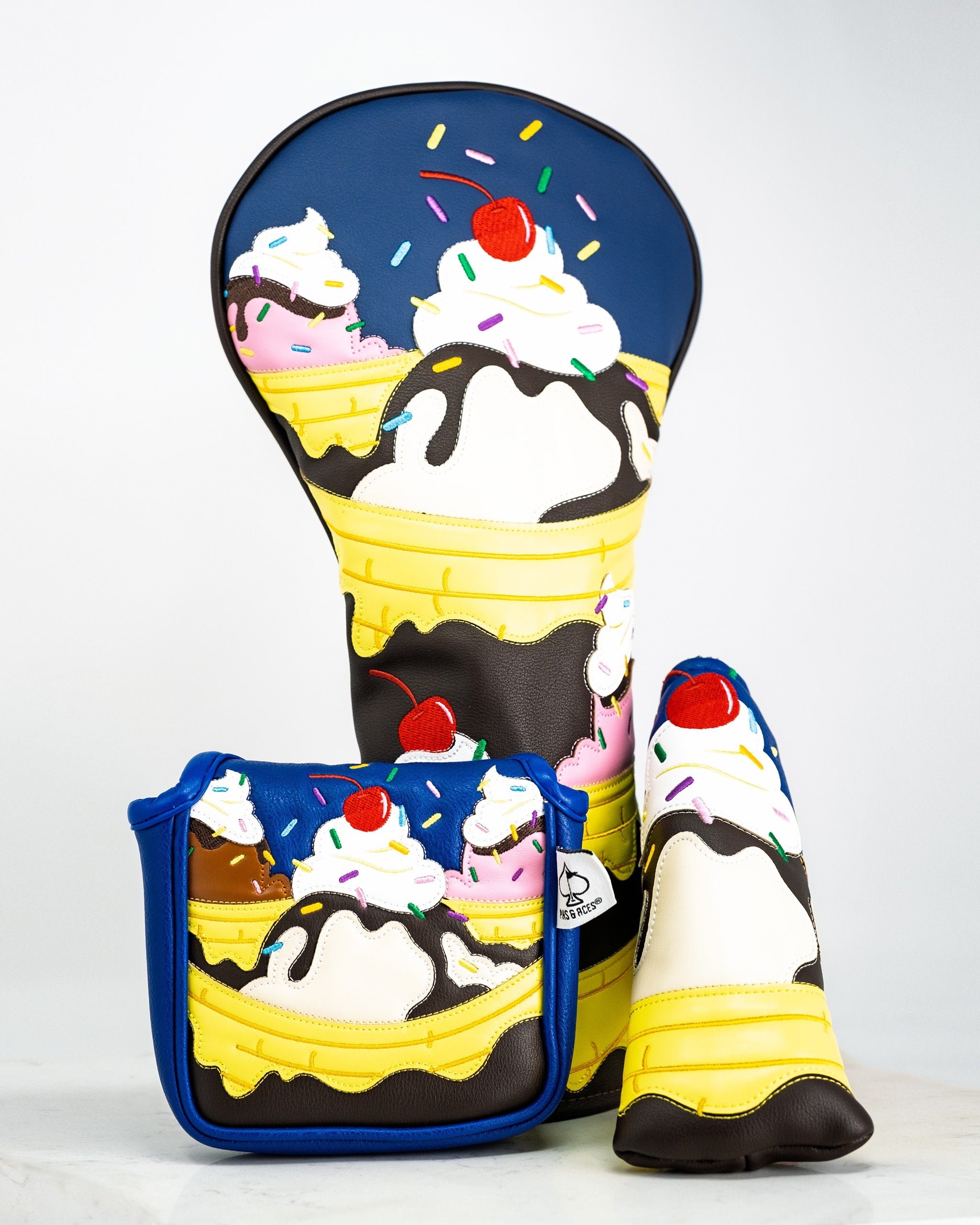 Colorful mallet putter cover featuring a playful banana split design with ice cream, sprinkles, and cherries on top.