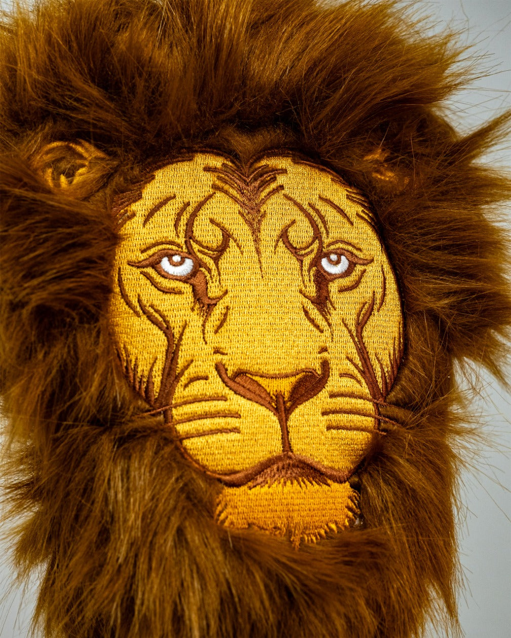 Bold lion driver cover featuring intricate embroidery and a plush mane, perfect for golfers wanting to stand out.