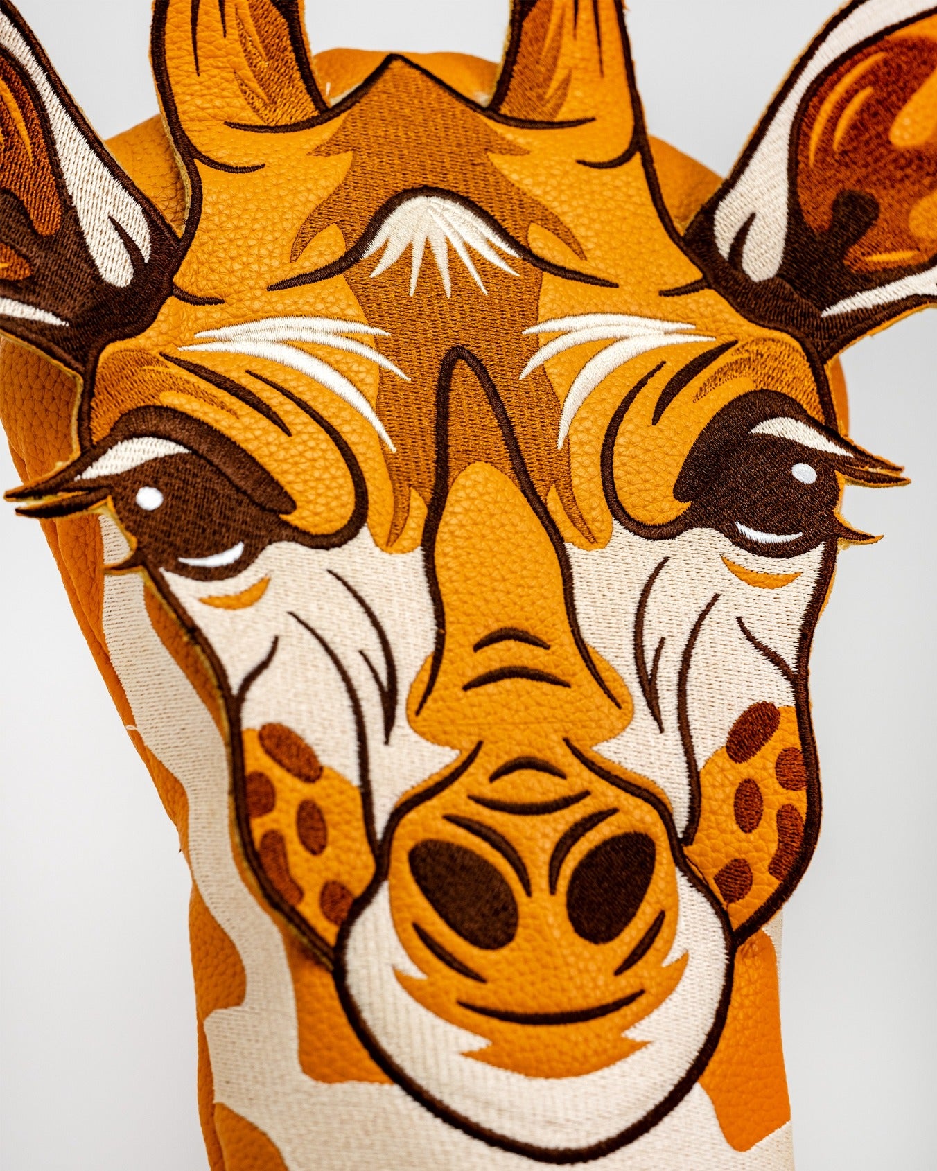 Giraffe driver cover featuring a detailed, colorful design of a giraffe's face, perfect for adding personality to your golf bag.