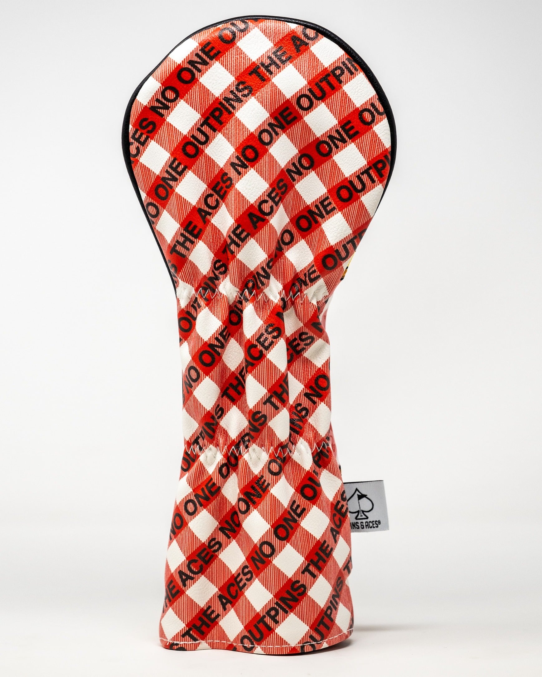 Bold red and white checkered fairway cover featuring "OUTDRIVE" and "NO ONE" text, designed for stylish golf protection.