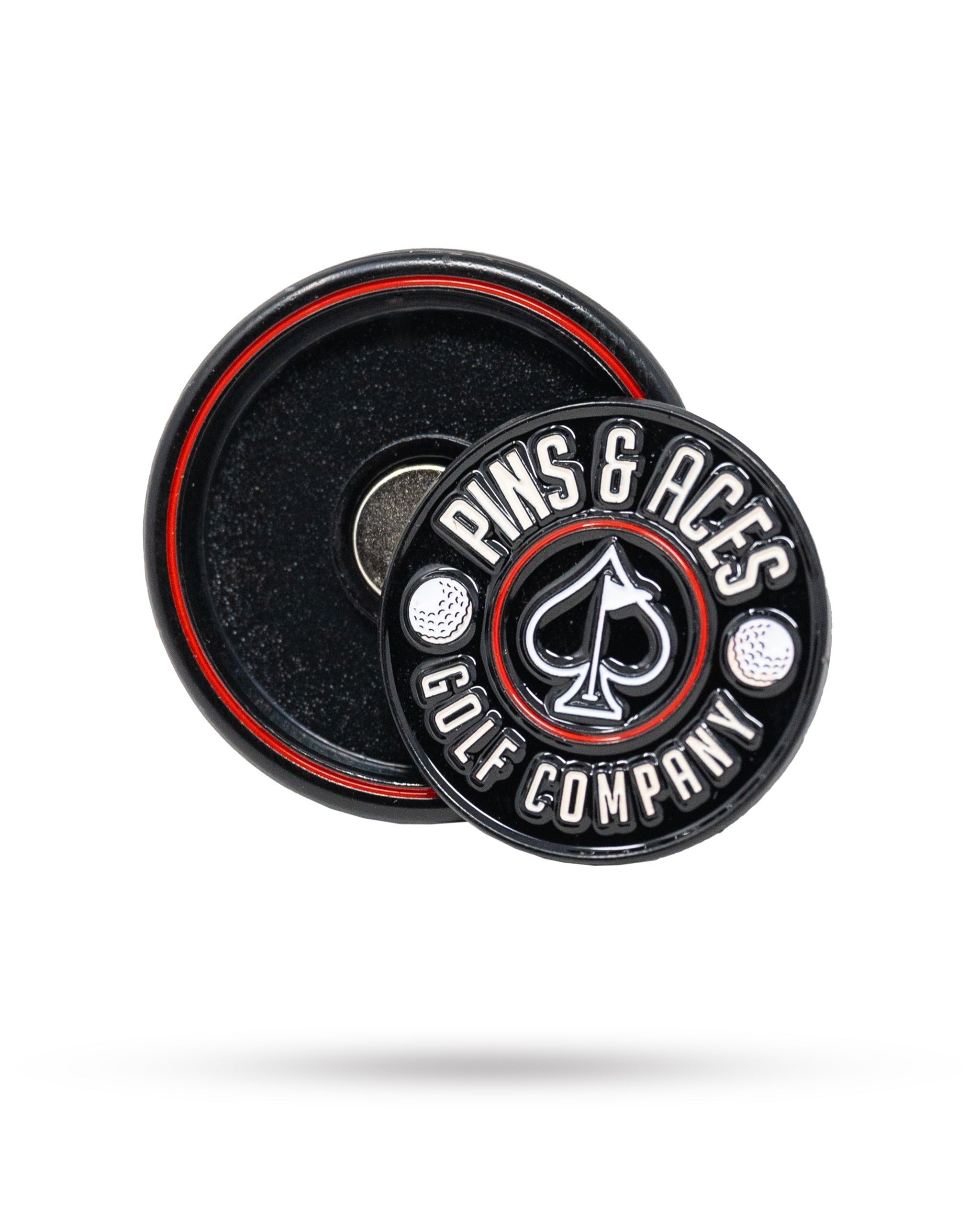Black Pop Out Medallion Ball Marker featuring the Pins & Aces logo, designed for stylish golf play and easy access.