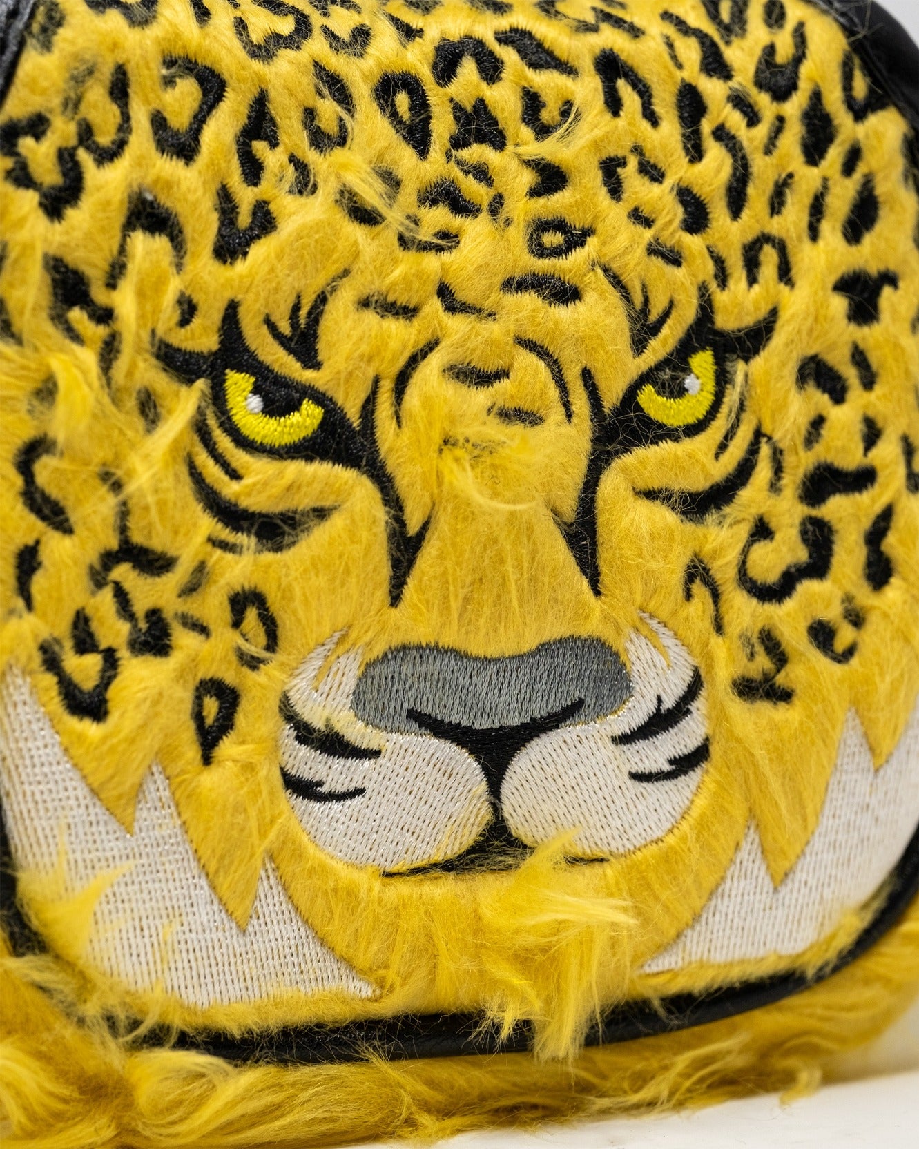 Bold leopard print mallet putter cover featuring a fierce leopard face design with vibrant yellow and black details.