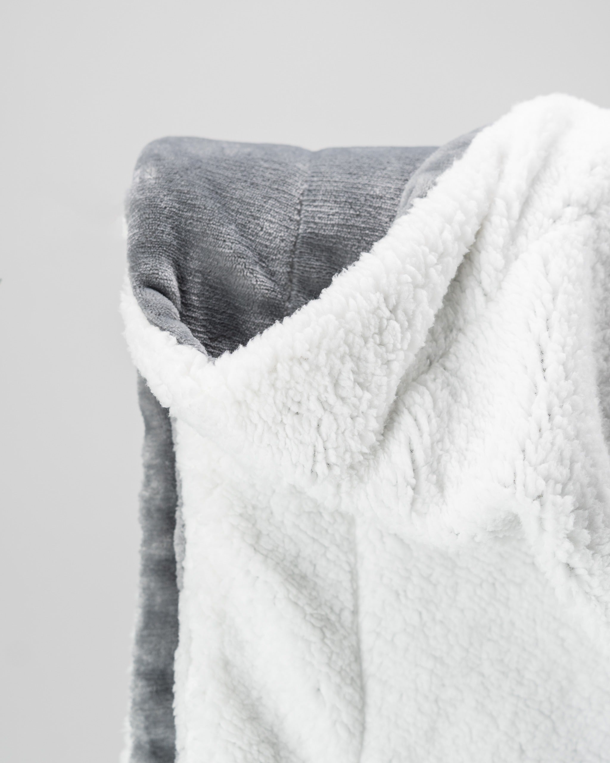 Cozy light gray Bogey Blanket featuring a soft, plush texture, perfect for warmth on and off the golf course.