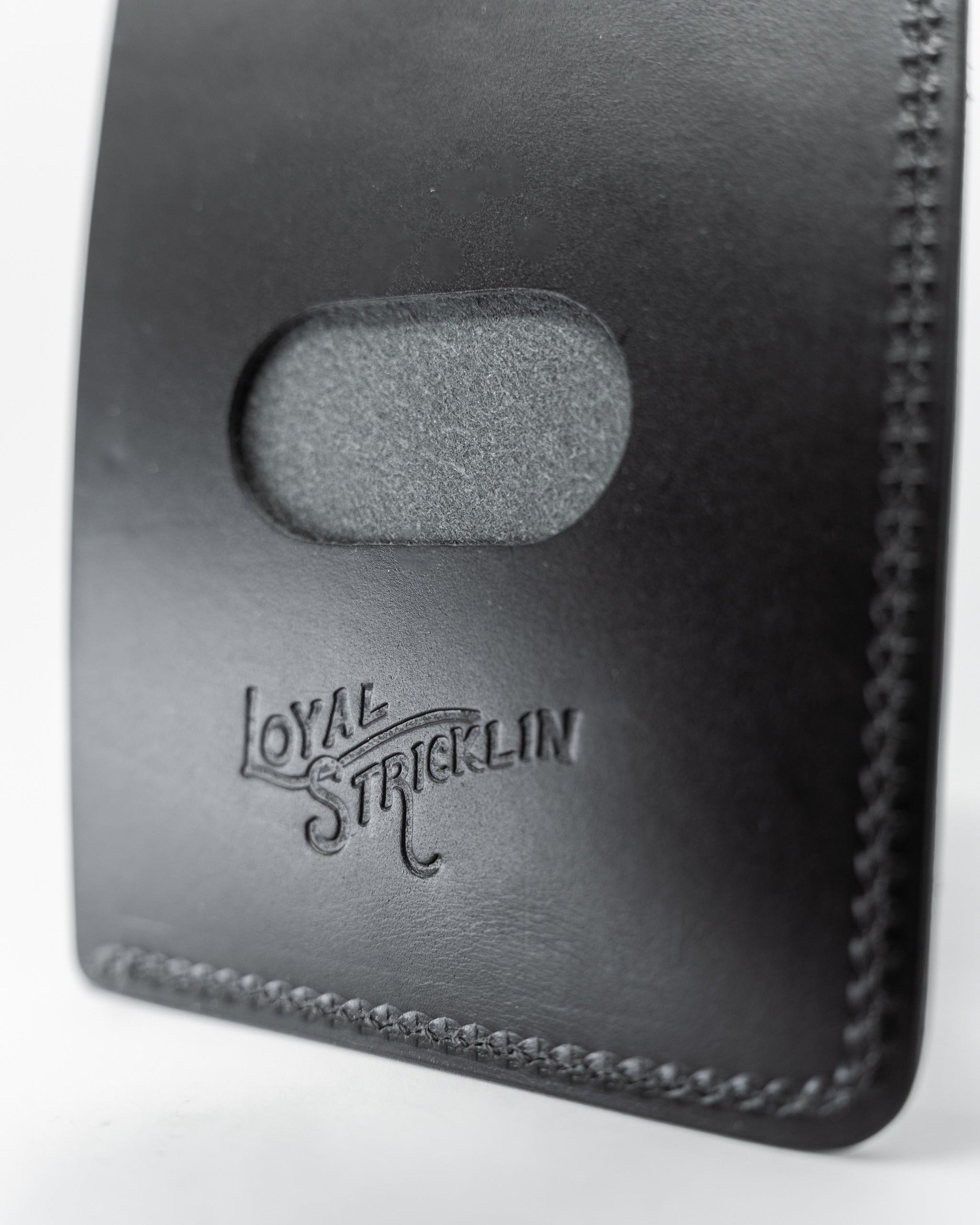 Smooth Italian black wallet featuring a sleek design and embossed logo, perfect for stylish everyday use.
