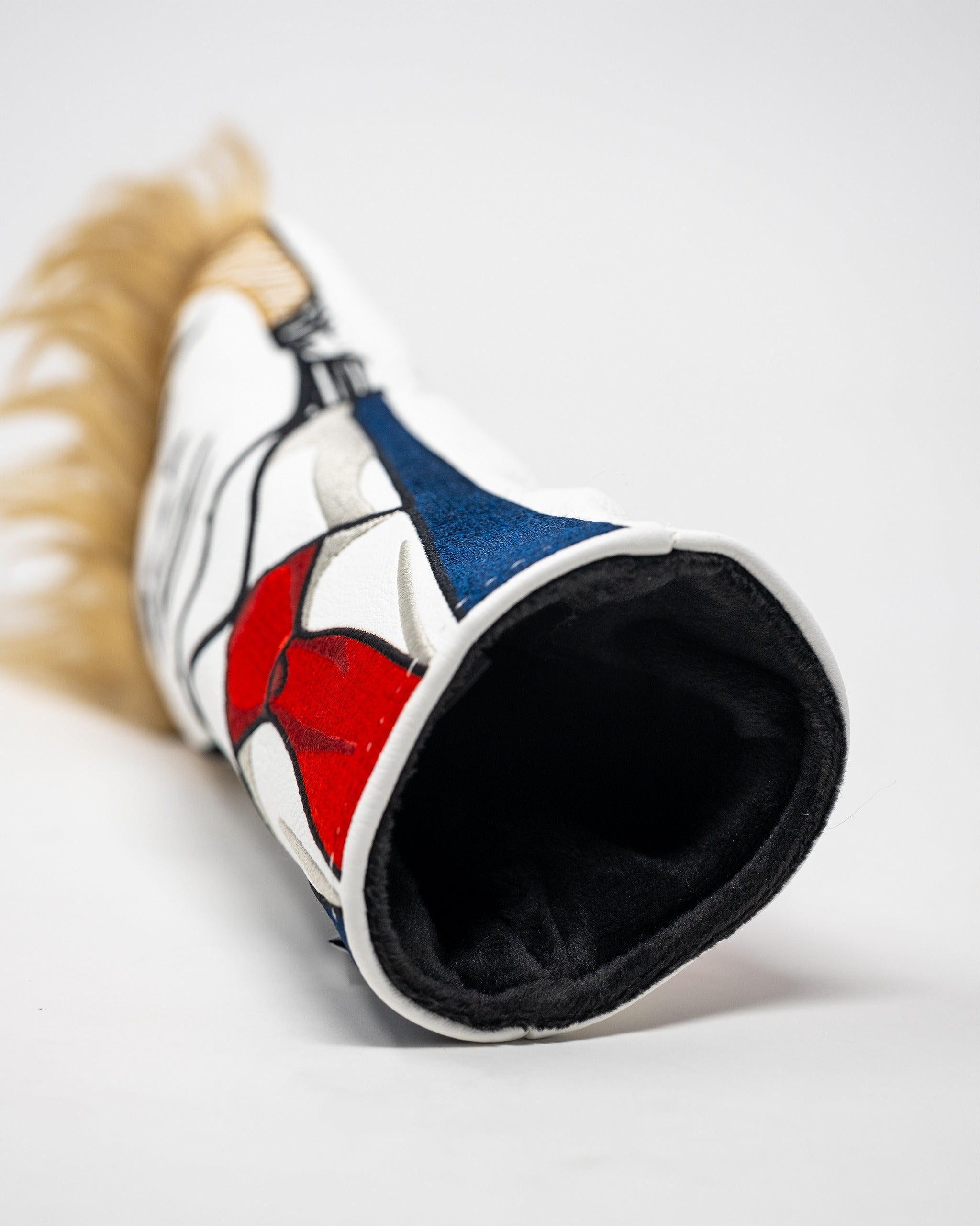 Bold Trump hybrid golf cover featuring a unique design with vibrant colors and a faux fur accent for added flair.