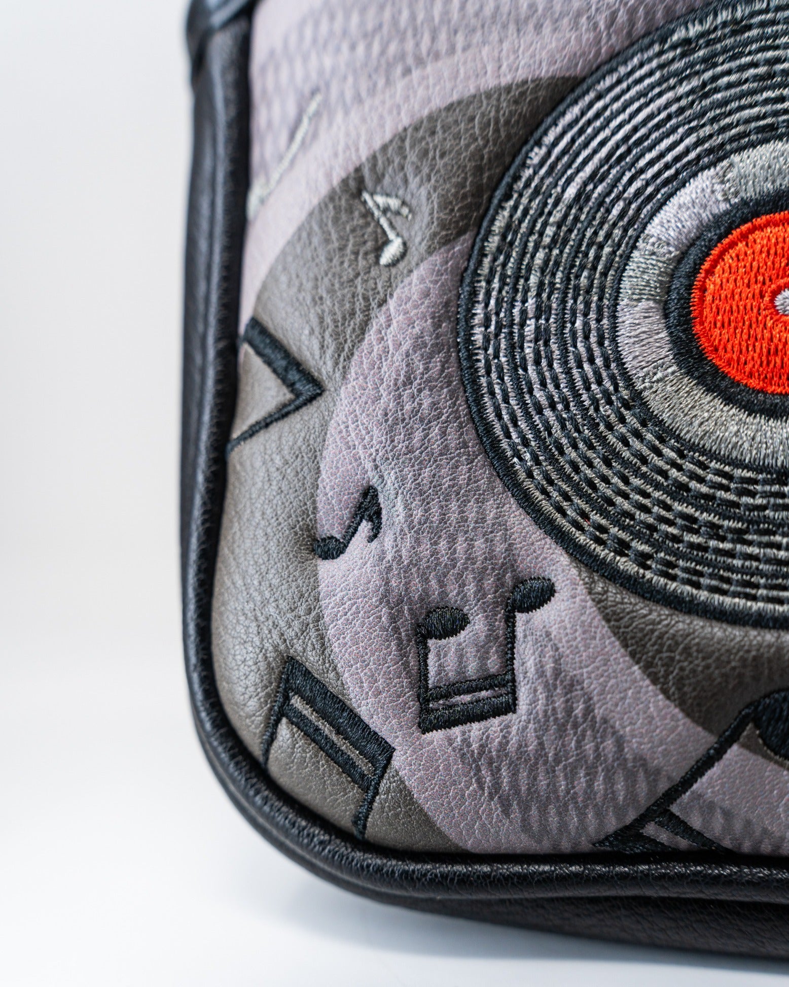 Bold mallet cover featuring a vinyl record design with musical notes, perfect for golfers who love music.