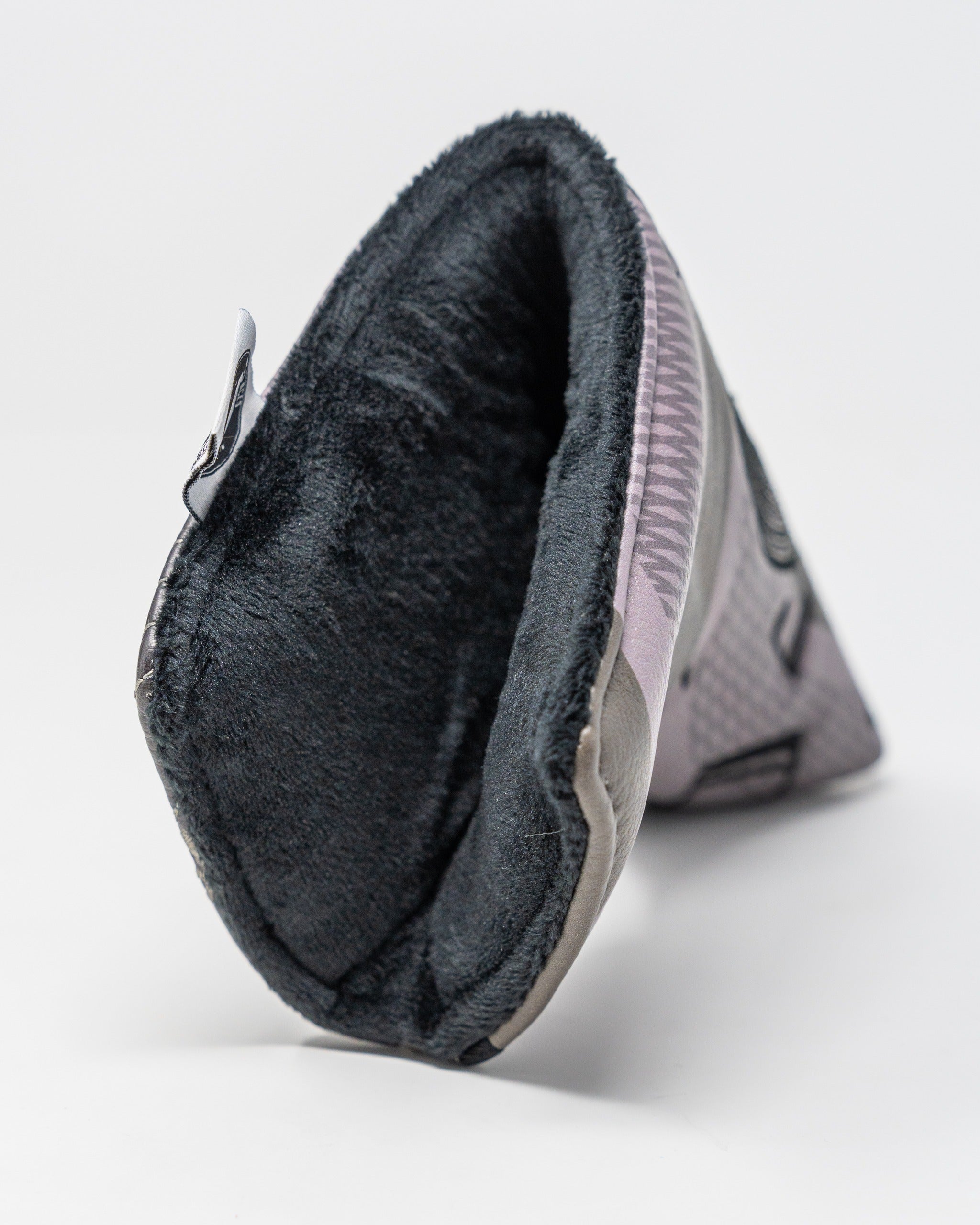 Music City blade putter cover featuring a soft interior lining and a stylish exterior design for golfers seeking unique accessories.