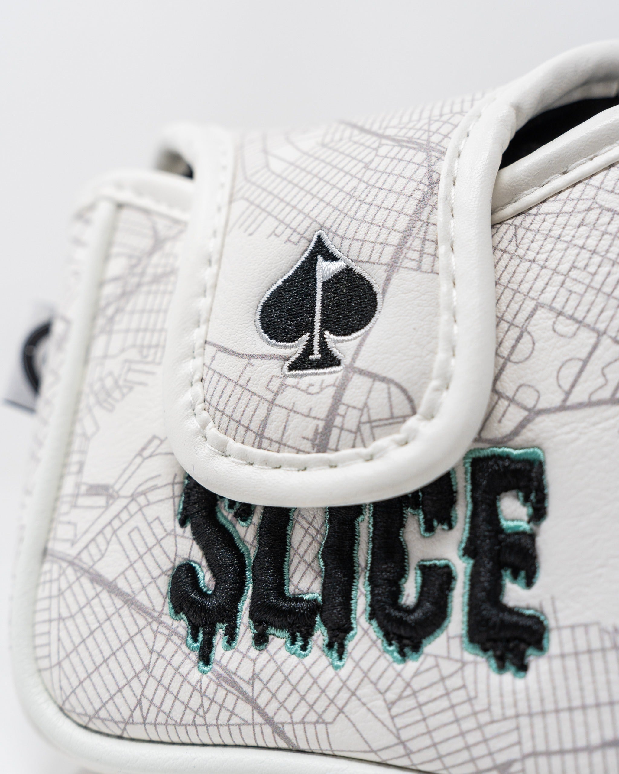 Shady Slice mallet cover featuring a spade logo and bold "SLICE" text on a textured white background.