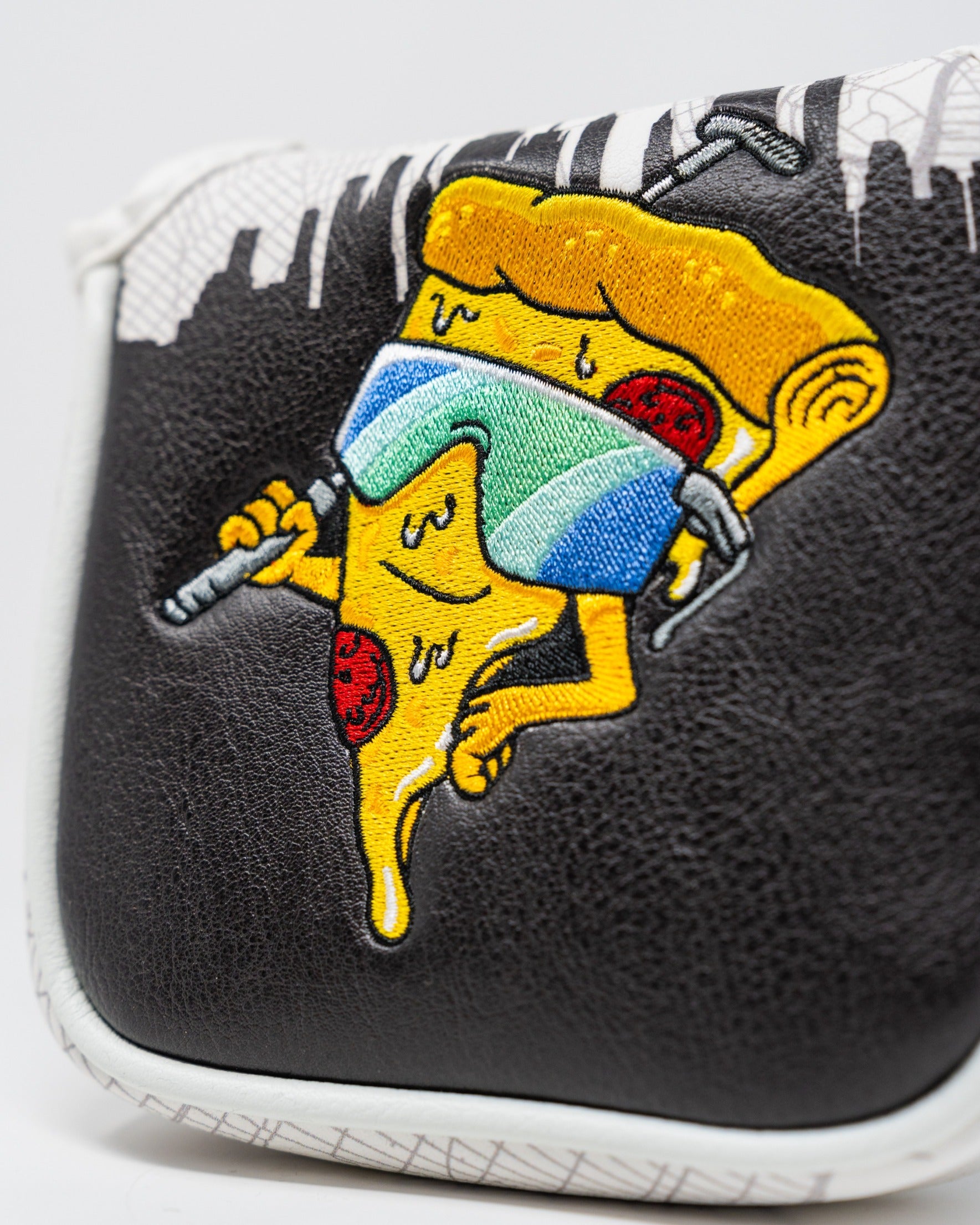 Bold mallet cover featuring a playful pizza slice character wearing sunglasses, perfect for adding fun to your golf game.