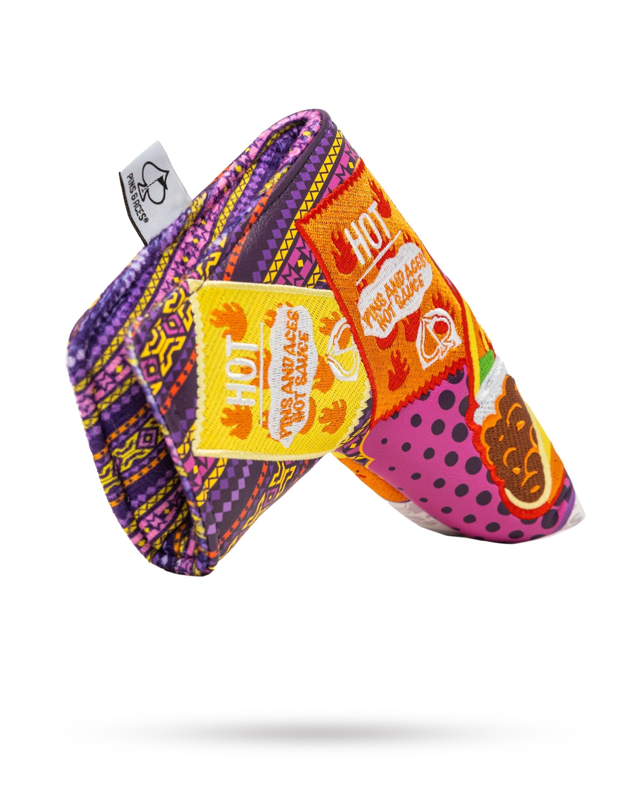Vibrant blade putter cover featuring bold patterns and playful graphics, designed for golfers who want to stand out.
