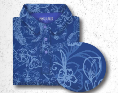 Women's Cabo Ocean golf polo featuring a vibrant blue floral pattern, designed for stylish performance on the course.