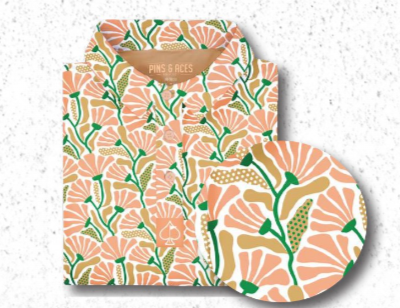 Women's Garden Party Spritz shirt featuring a vibrant floral pattern in pink, green, and beige, perfect for stylish golfers.