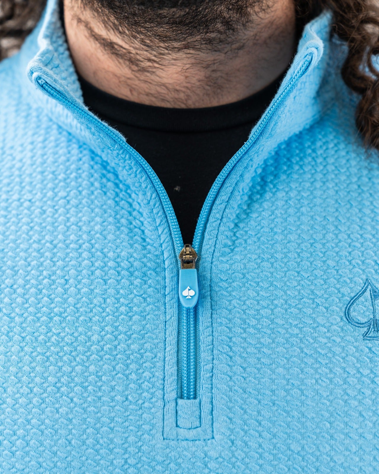Blue Steel Player Preferred Waffle Knit Pullover featuring a half-zip design and textured fabric for comfort on the golf course.