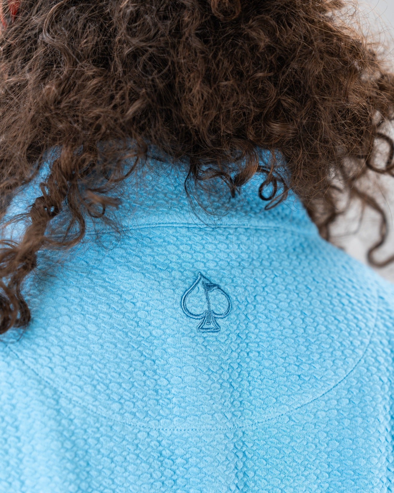 Blue Steel Player Preferred Waffle Knit Pullover featuring a stylish spade logo on the back collar, ideal for golfers.
