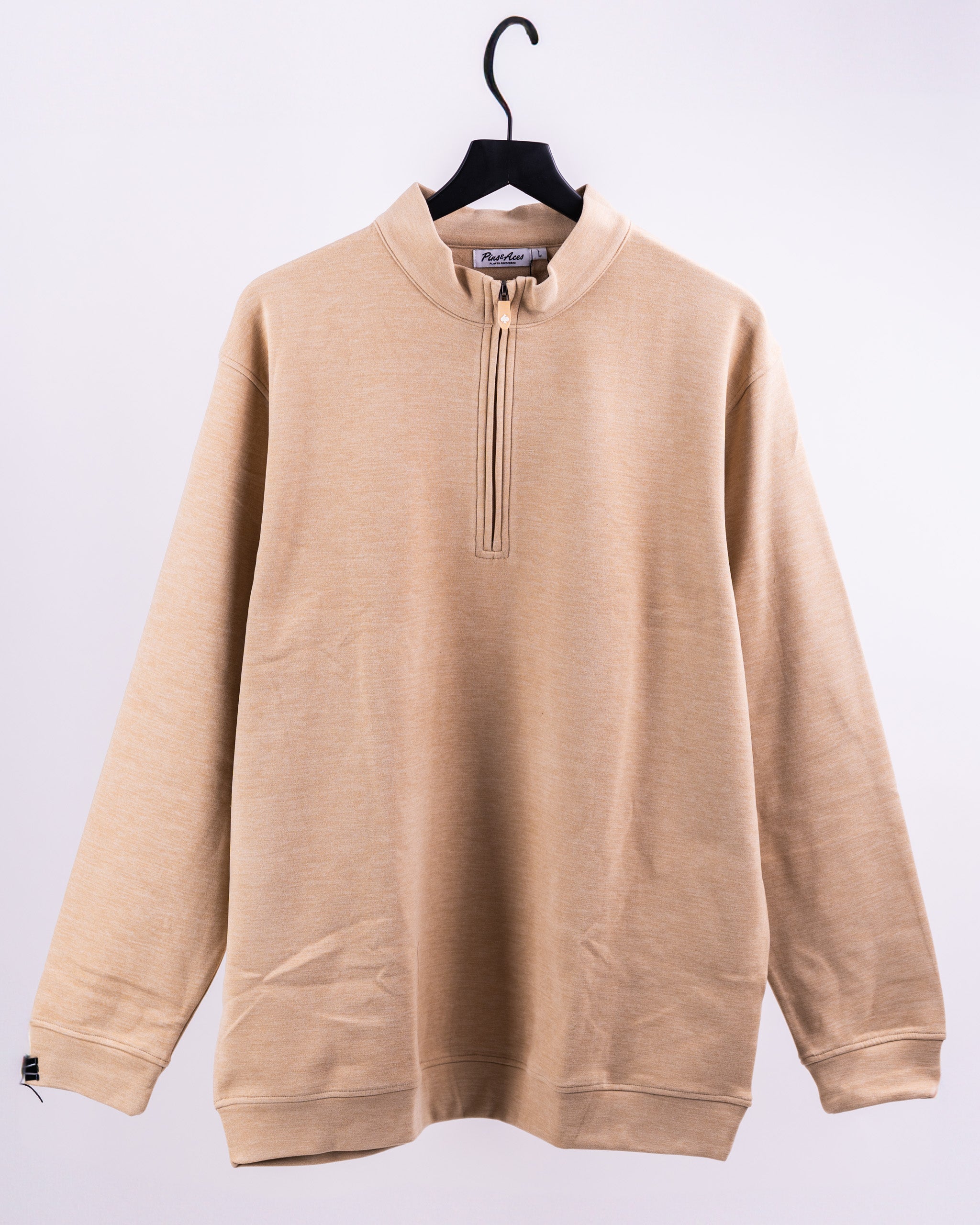 Player Preferred Pullover in sand color featuring a quarter-zip design and a relaxed fit for comfortable golfing.