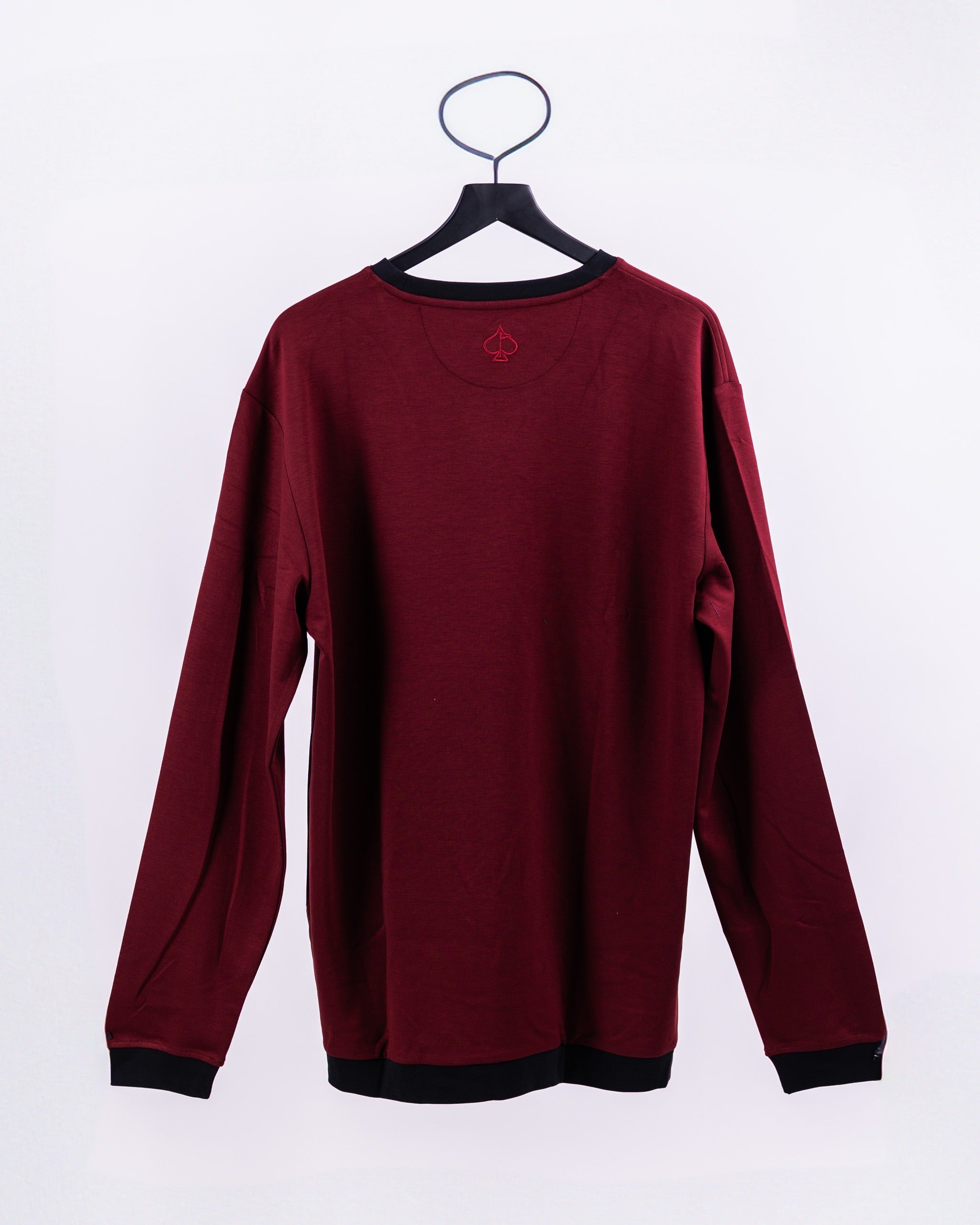 Back view of the Player Preferred Crewneck in Merlot, featuring a relaxed fit and contrasting black cuffs.