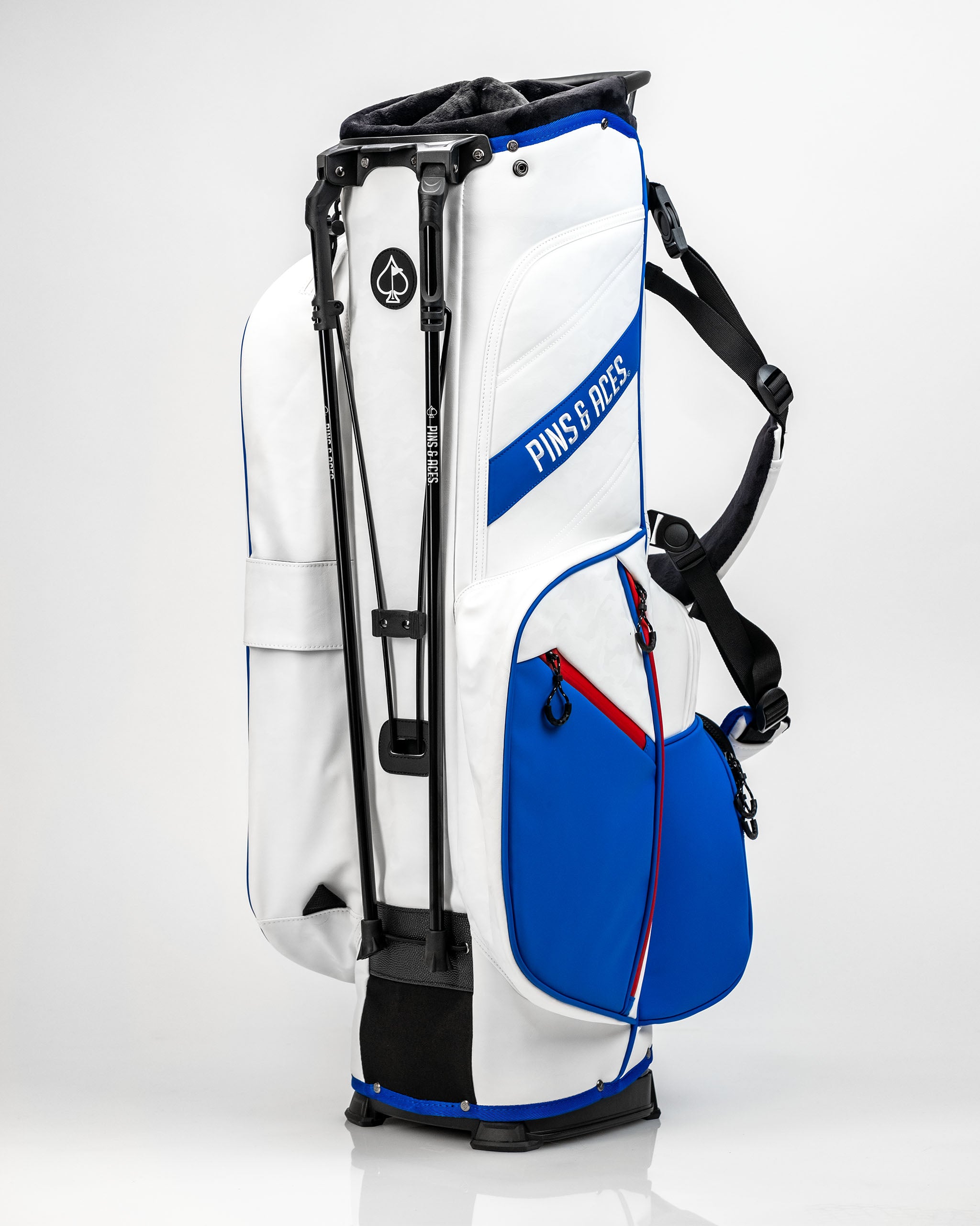 Stylish Player Preferred Golf Bag in white and blue, featuring multiple pockets and a comfortable shoulder strap for golfers.
