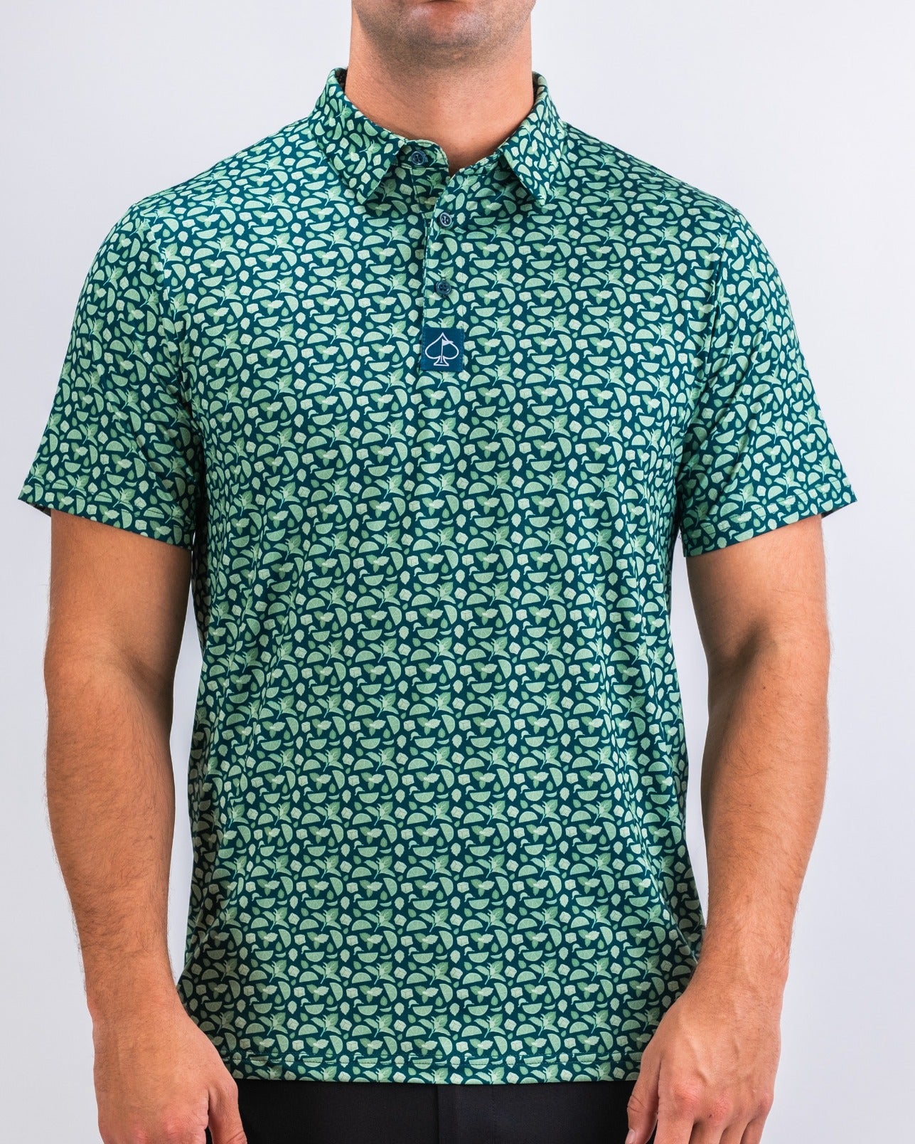 Men's short-sleeve golf shirt in mint green with a playful pattern, featuring a button-up collar and a modern fit.