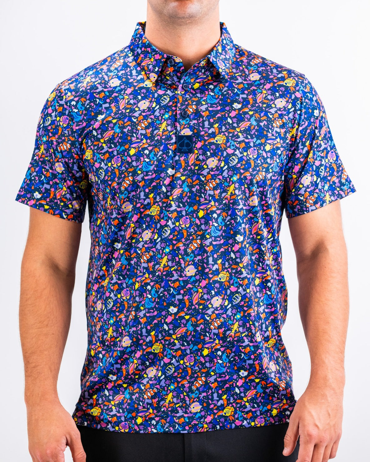 Bold tropical print golf shirt featuring vibrant colors and playful patterns, perfect for golfers who want to stand out.